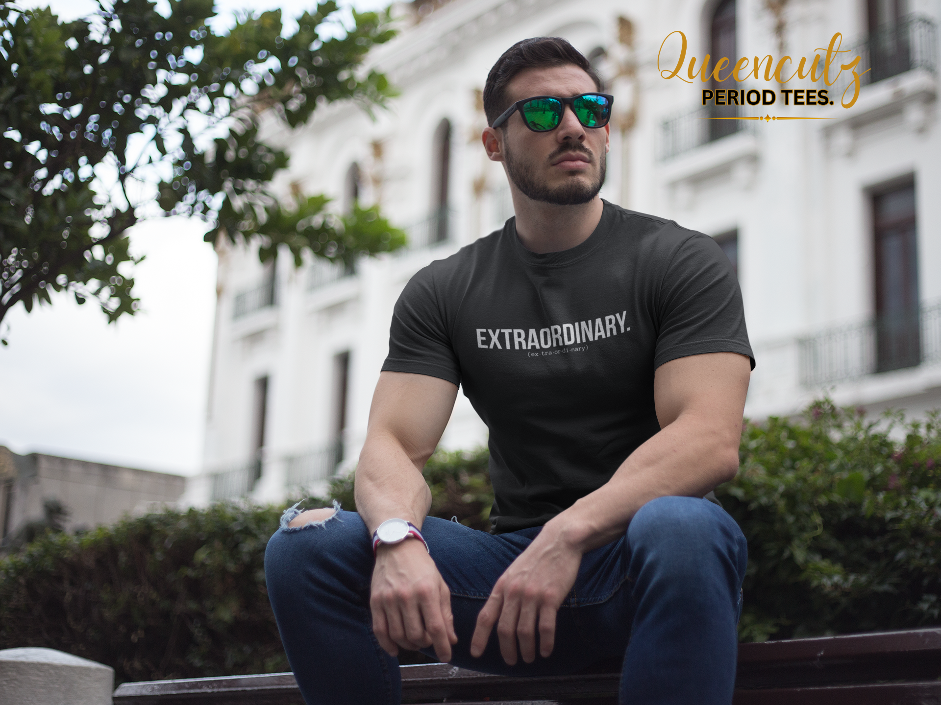 buff-guy-wearing-a-tshirt-mockup-while-sitting-a17683.png