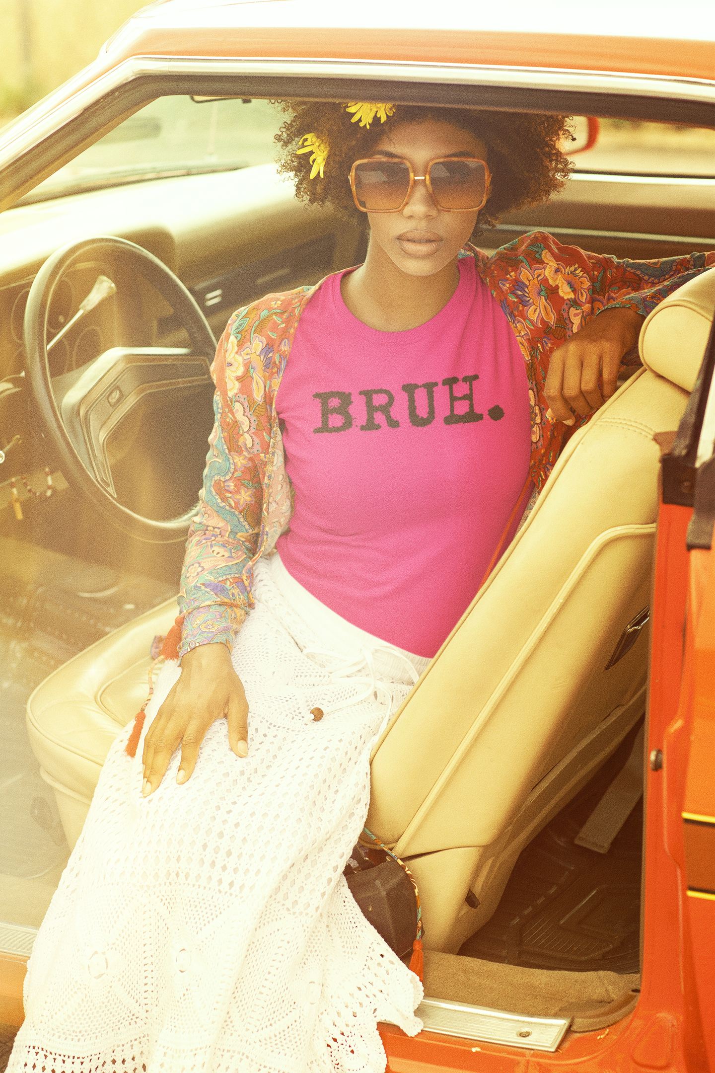 70-s-t-shirt-mockup-featuring-a-hippie-woman-posing-in-a-car-seat-m10504.png