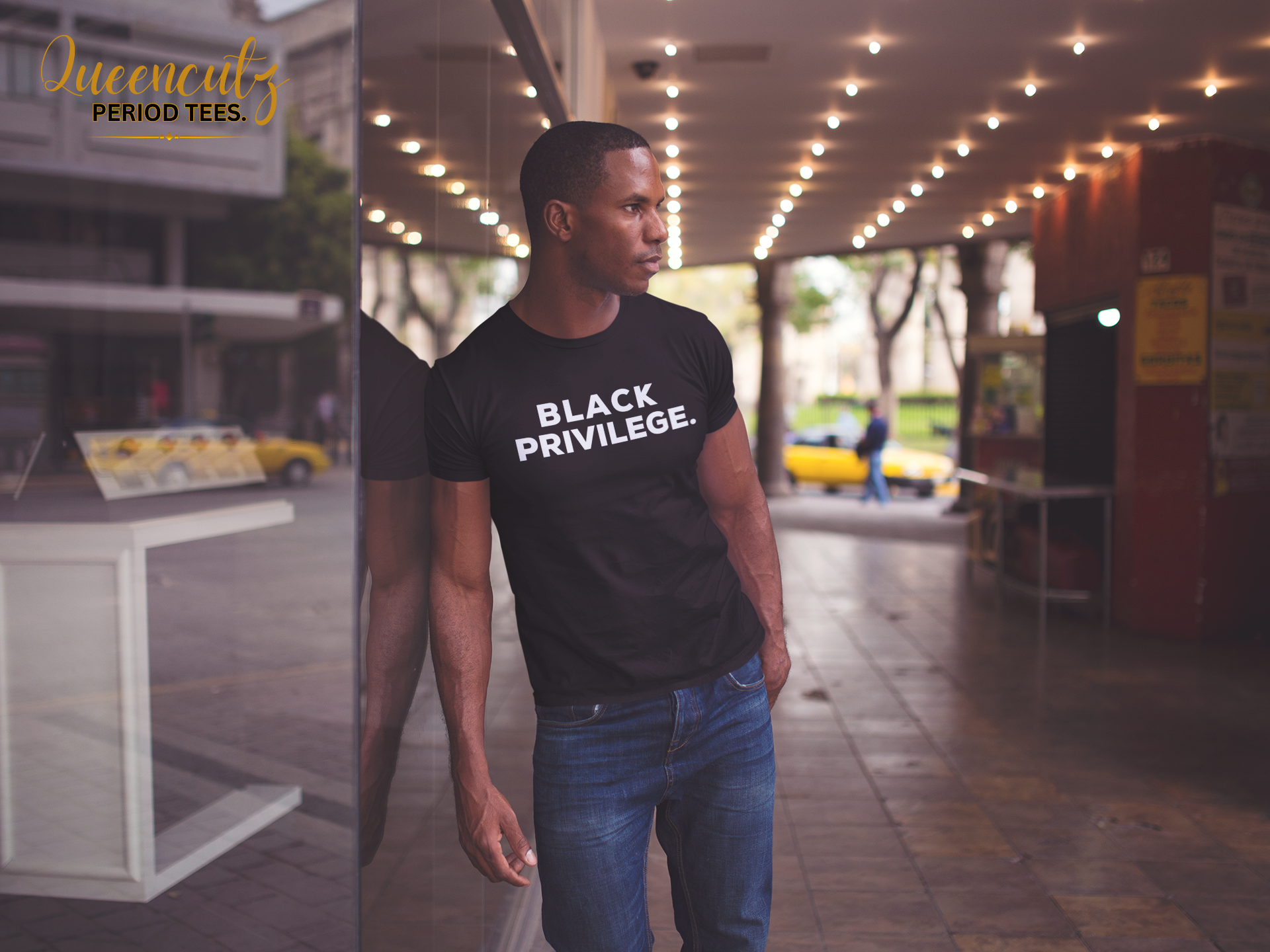 young-black-man-wearing-a-tshirt-while-lying-against-a-shop-window-in-the-street-mockup-a14229.png