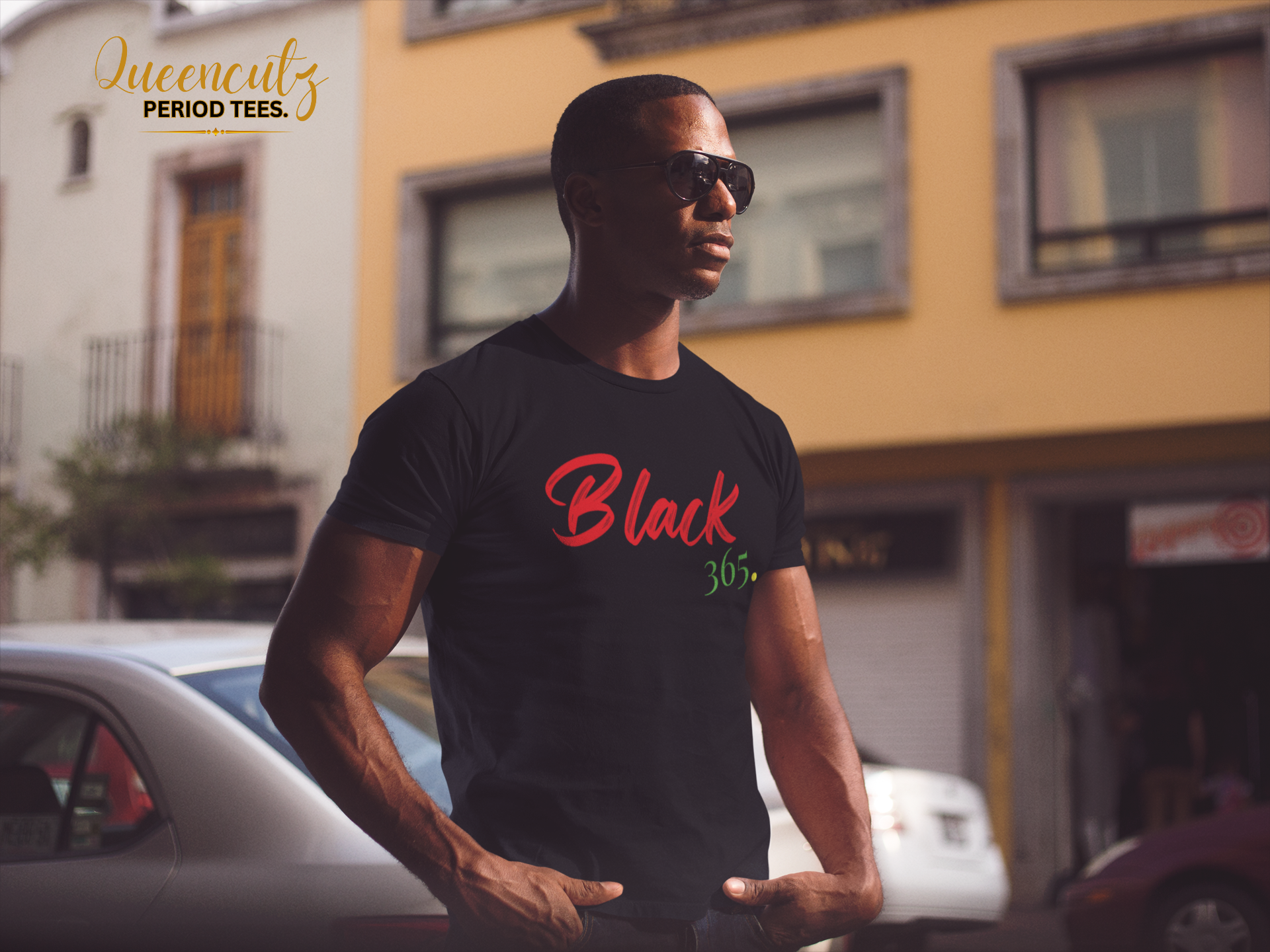 young-black-man-wearing-a-short-sleeved-round-neck-t-shirt-and-sunglasses-while-staring-at-the-city-mockup-a14220.png
