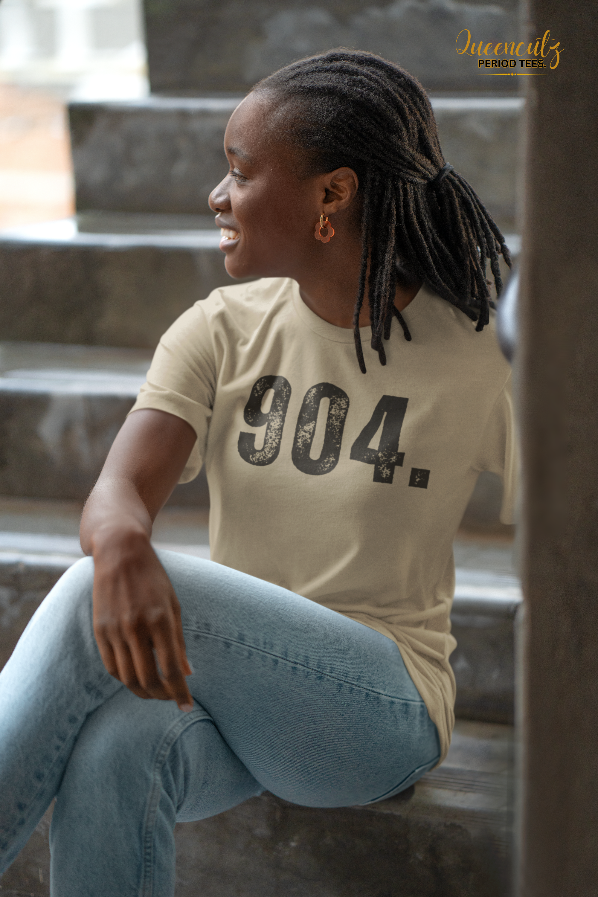 bella-canvas-mockup-featuring-a-smiling-woman-wearing-a-t-shirt-and-sitting-on-a-staircase-m39807 (1).png
