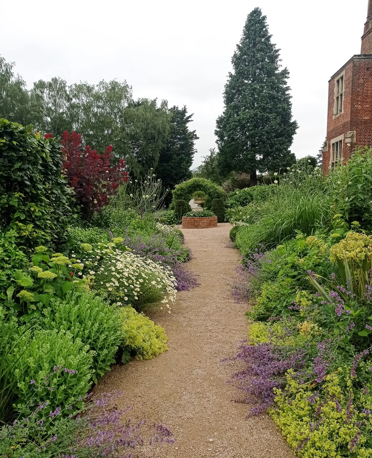 Vibrant Spring colour in mixed borders in Stoke Poges

