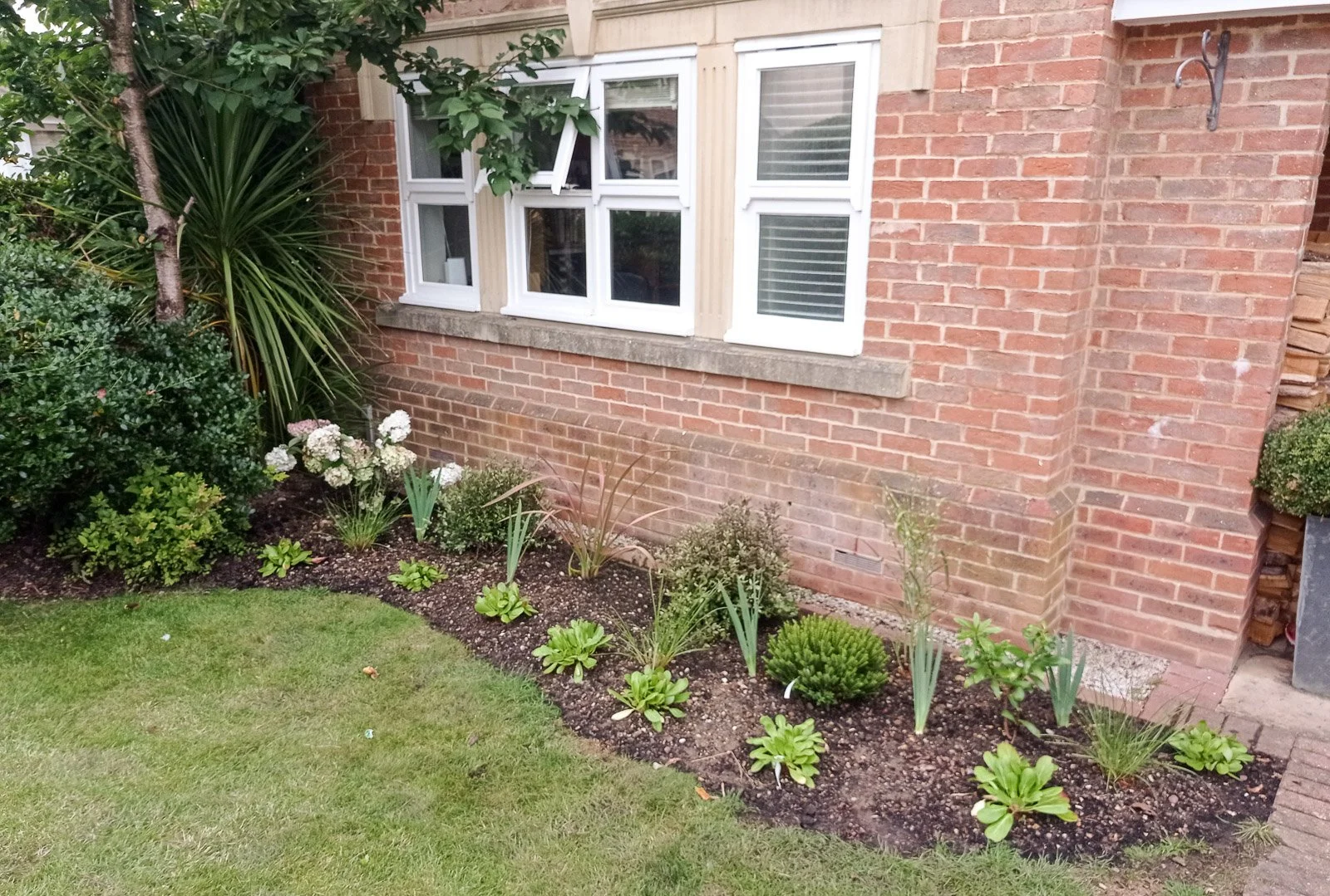 Newly planted front garden, these plants will fill in within 2-3 years given height, colour and movement