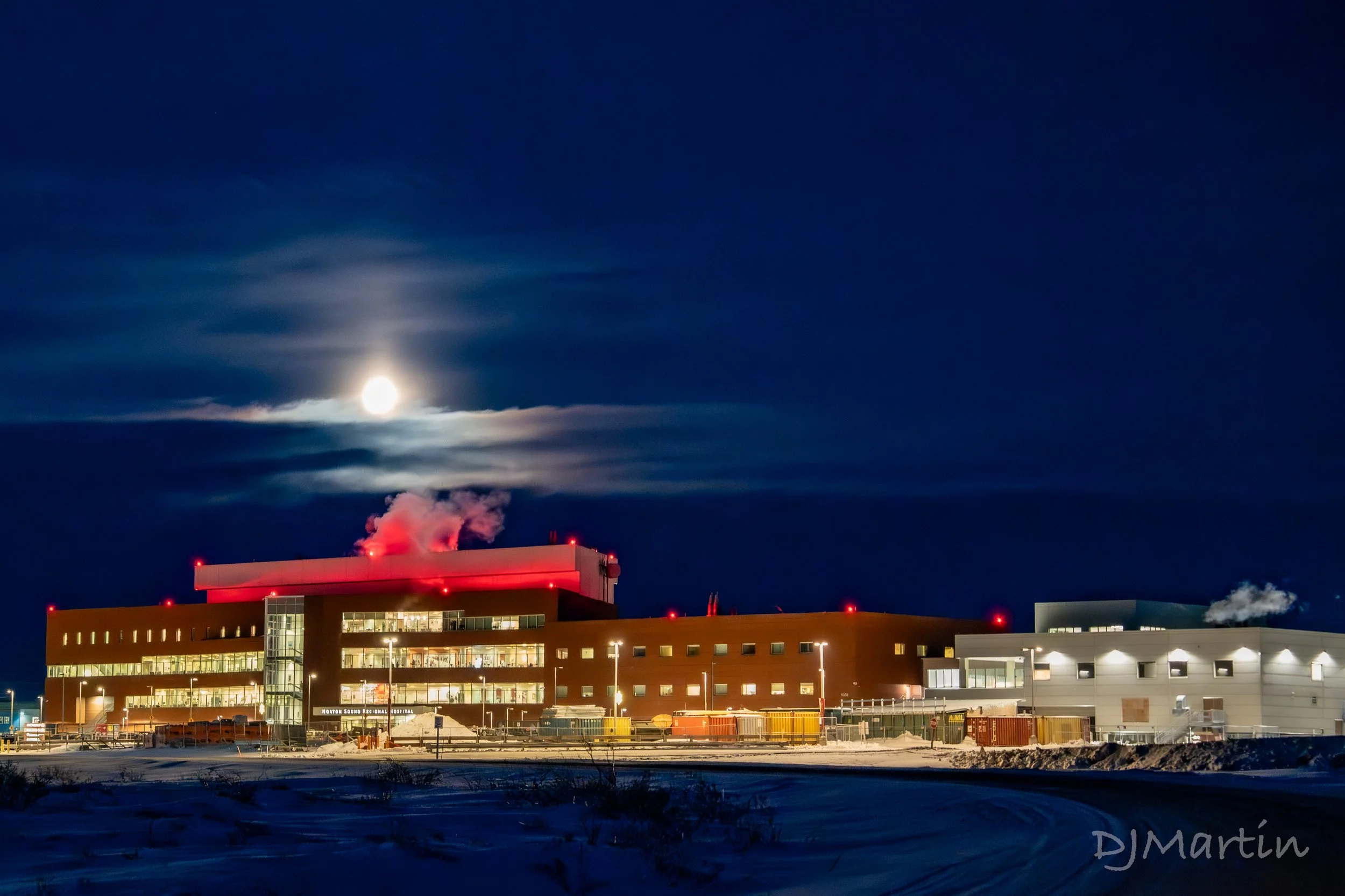 Norton Sound Hospital lit up by by the Moon