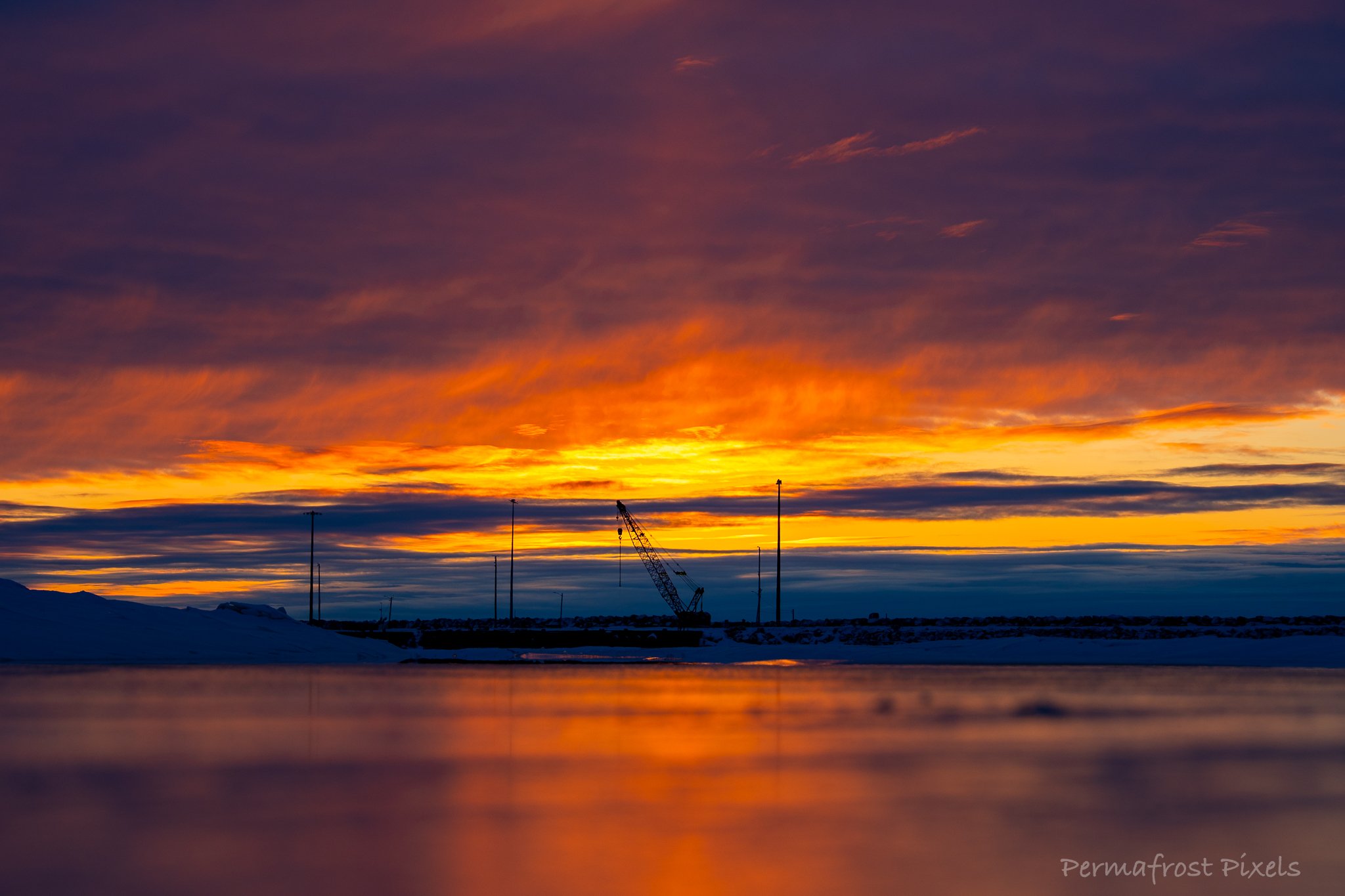 fire and ice sunset during extreme cold in Nome, Alaska.