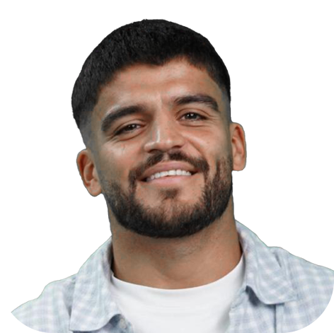A man with dark hair and a beard smiling at the camera against a white background.