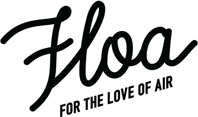 Stylized script spelling 'Flora' with the tagline 'For the love of air' beneath.