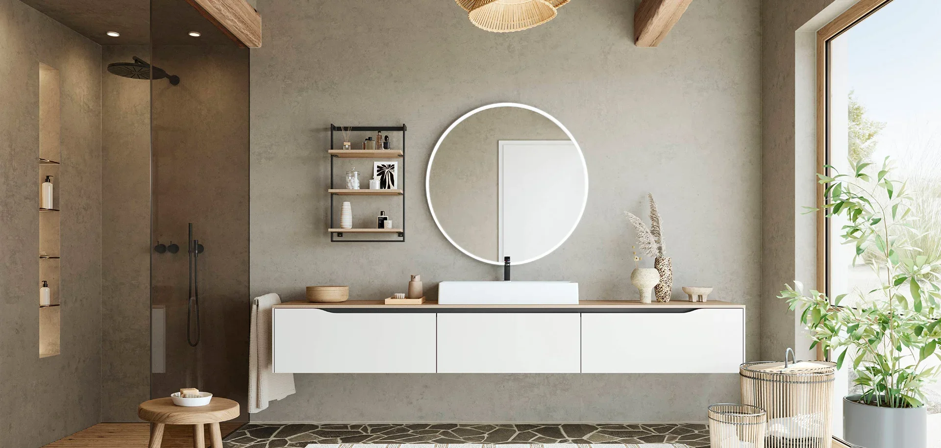 Modern bathroom with a minimalist white vanity, circular mirror with LED light, wooden accents, small black shelf with decorative items, indoor plants, and a walk-in shower with dark gray tiles and a rain shower head.