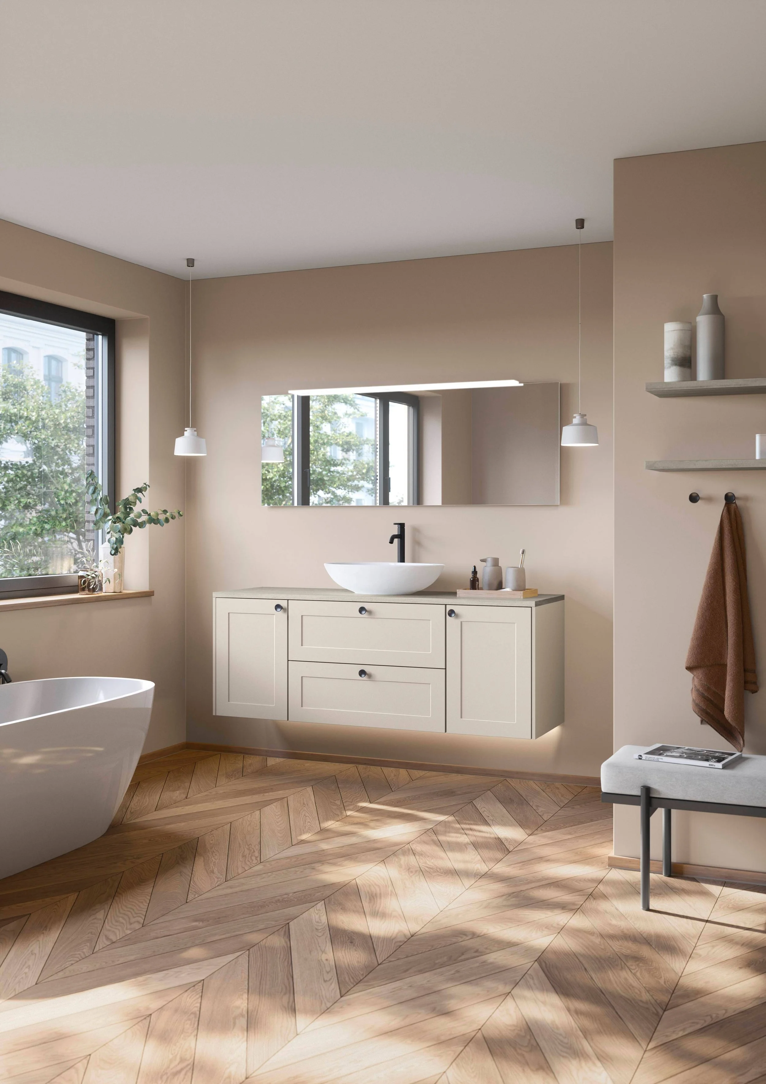 Modern bathroom with beige walls, large window, white vanity with a vessel sink, mirror, pendant lights, wooden herringbone floor, and decorative vases on a shelf.