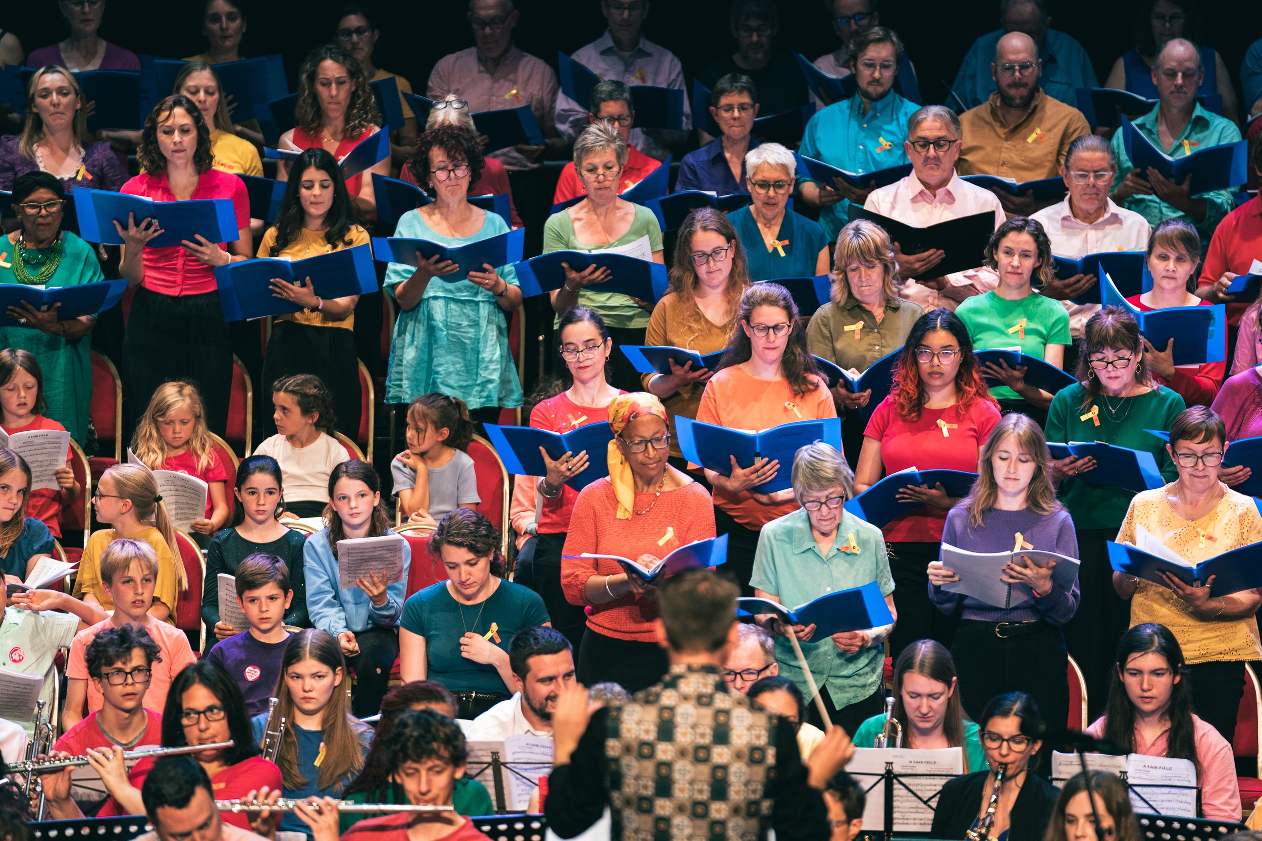 Matthew Hardy conducts the massed ensemble