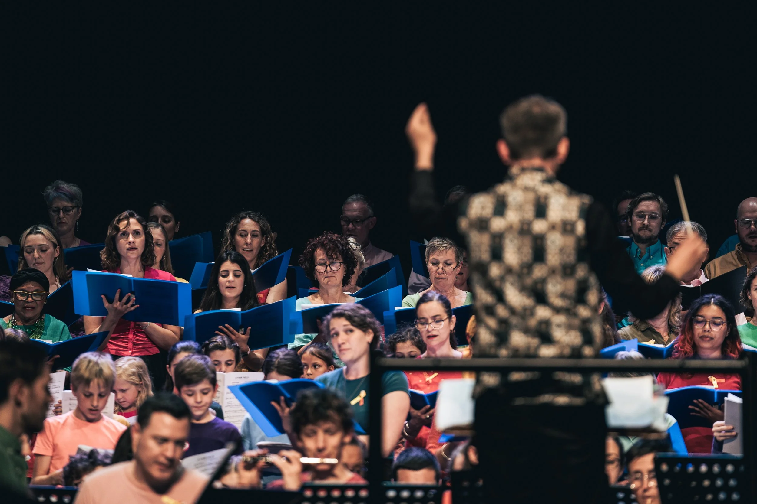 Matthew Hardy directing the massed ensemble