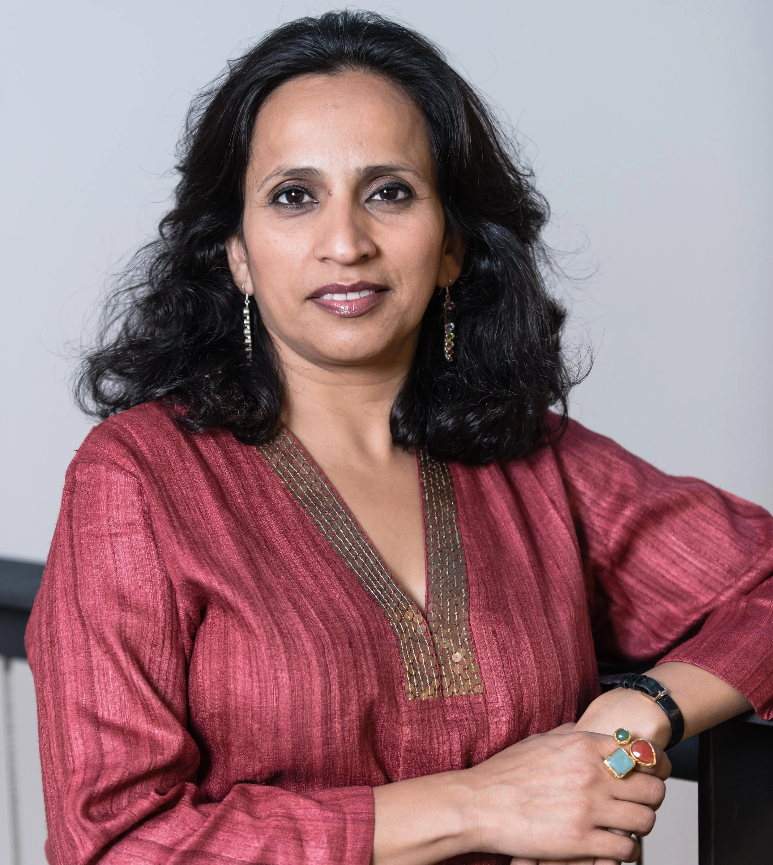 Headshot of Urja Desai Thakore, Artistic Director of Pagrav Dance Company, photographed by DanceWest.