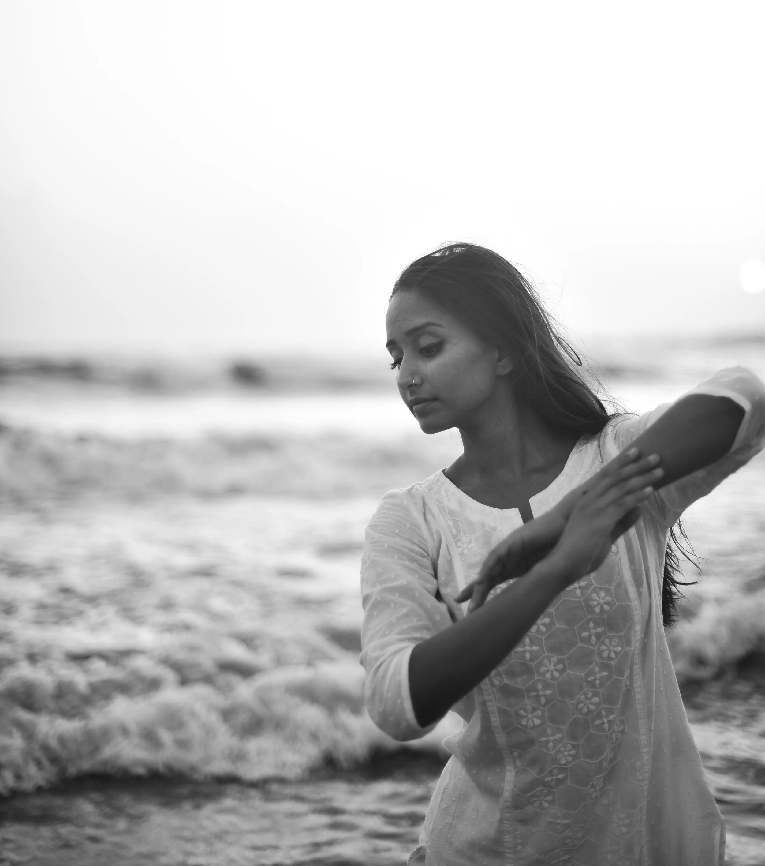 Saloni Saraf posing in a Kathak pose on a beach, photographed by Urvi Desale