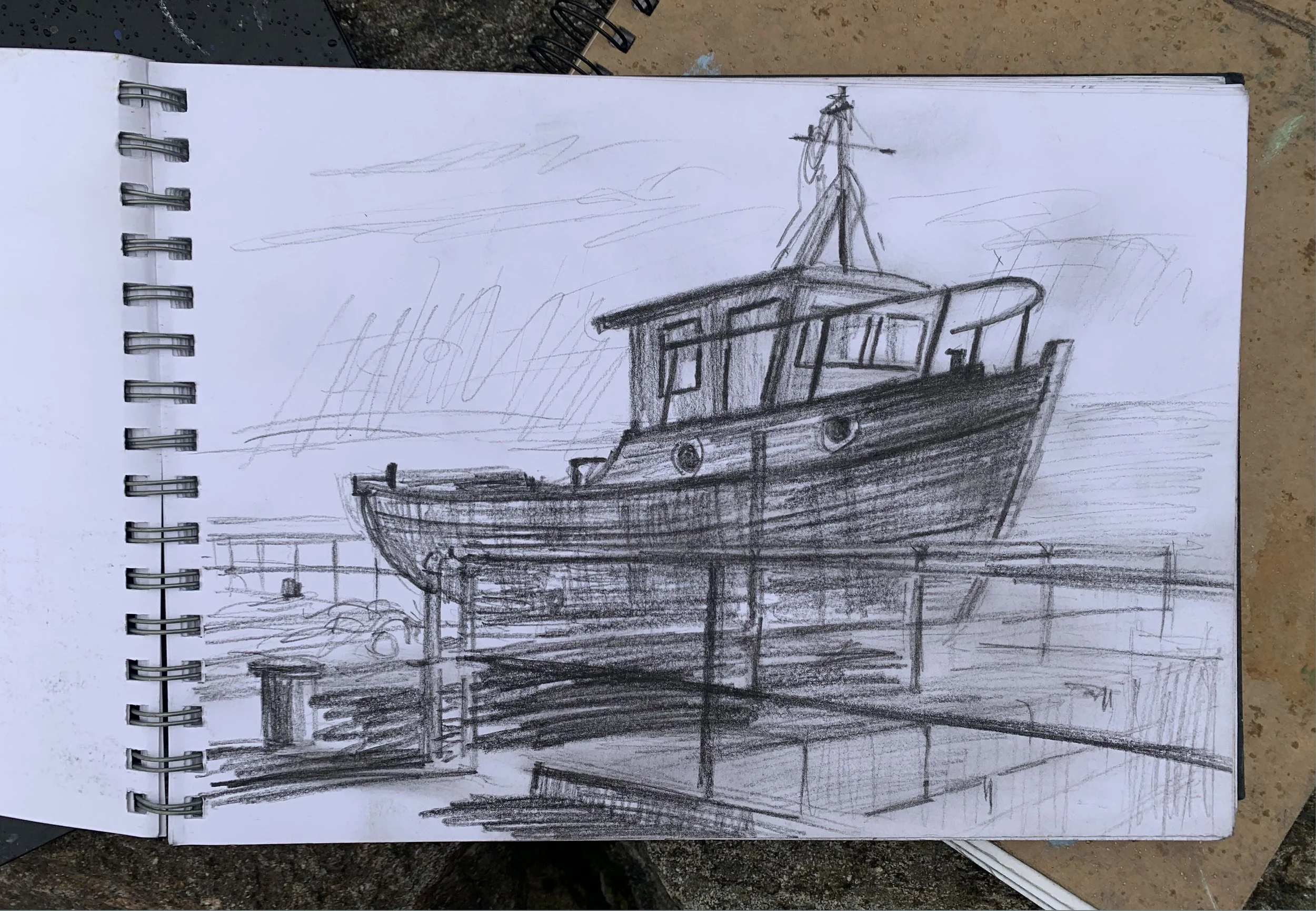 This lovely boat sits up on the key by the river  in Thurso