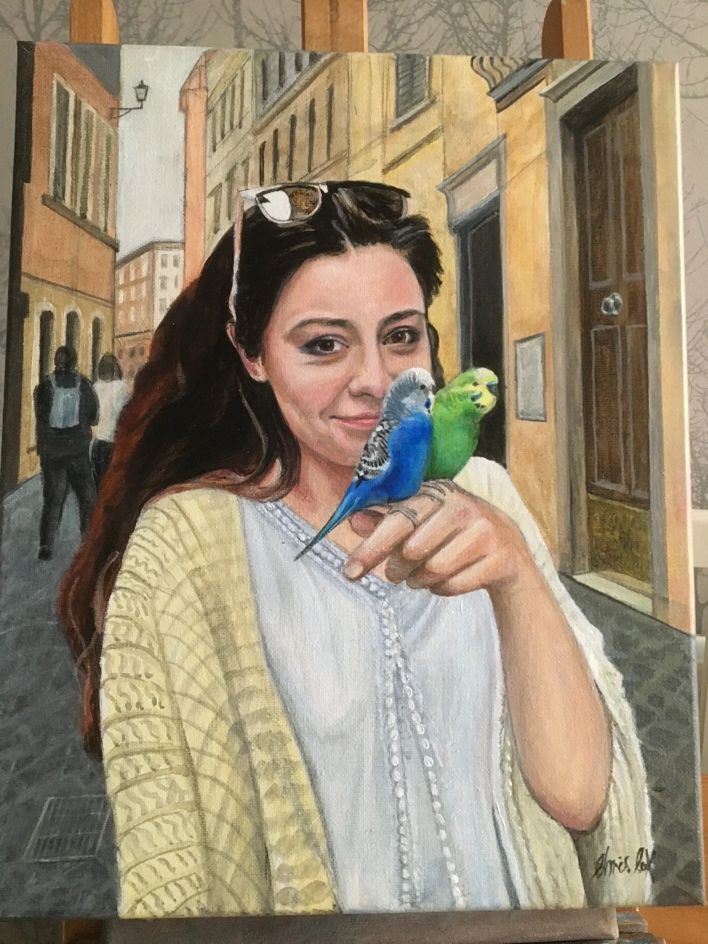 Chloe with budgies