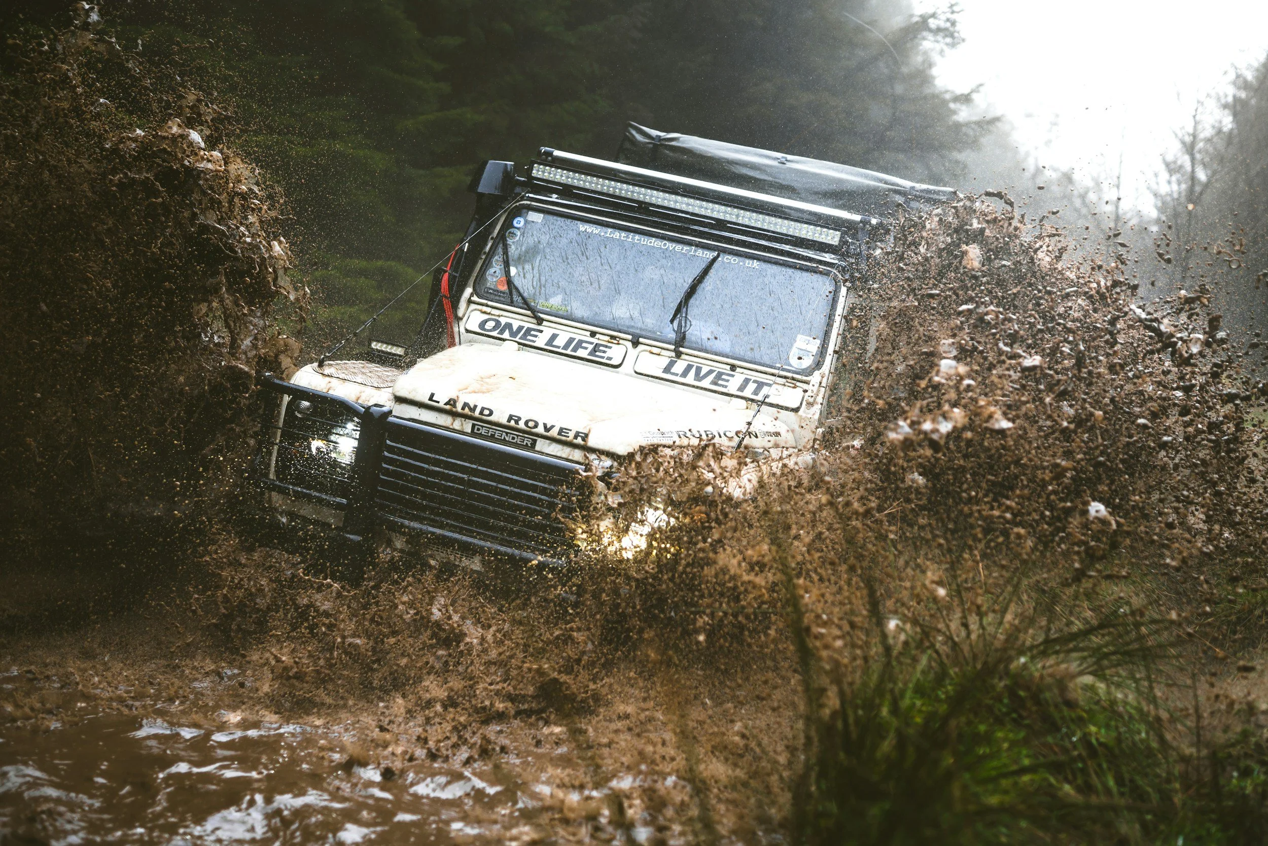 Land rover off-roading in mud. Lasalle interior trim.