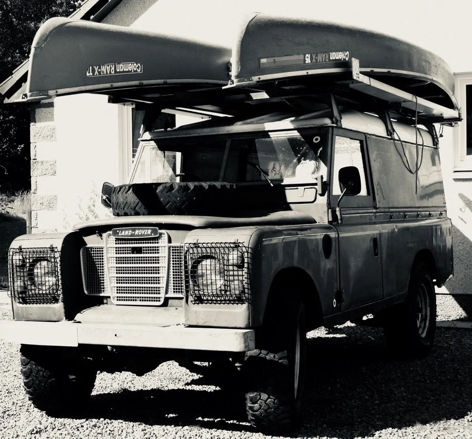 Lasalle Interior Trim land rover series II. Canoes being transported on roof of land rover.