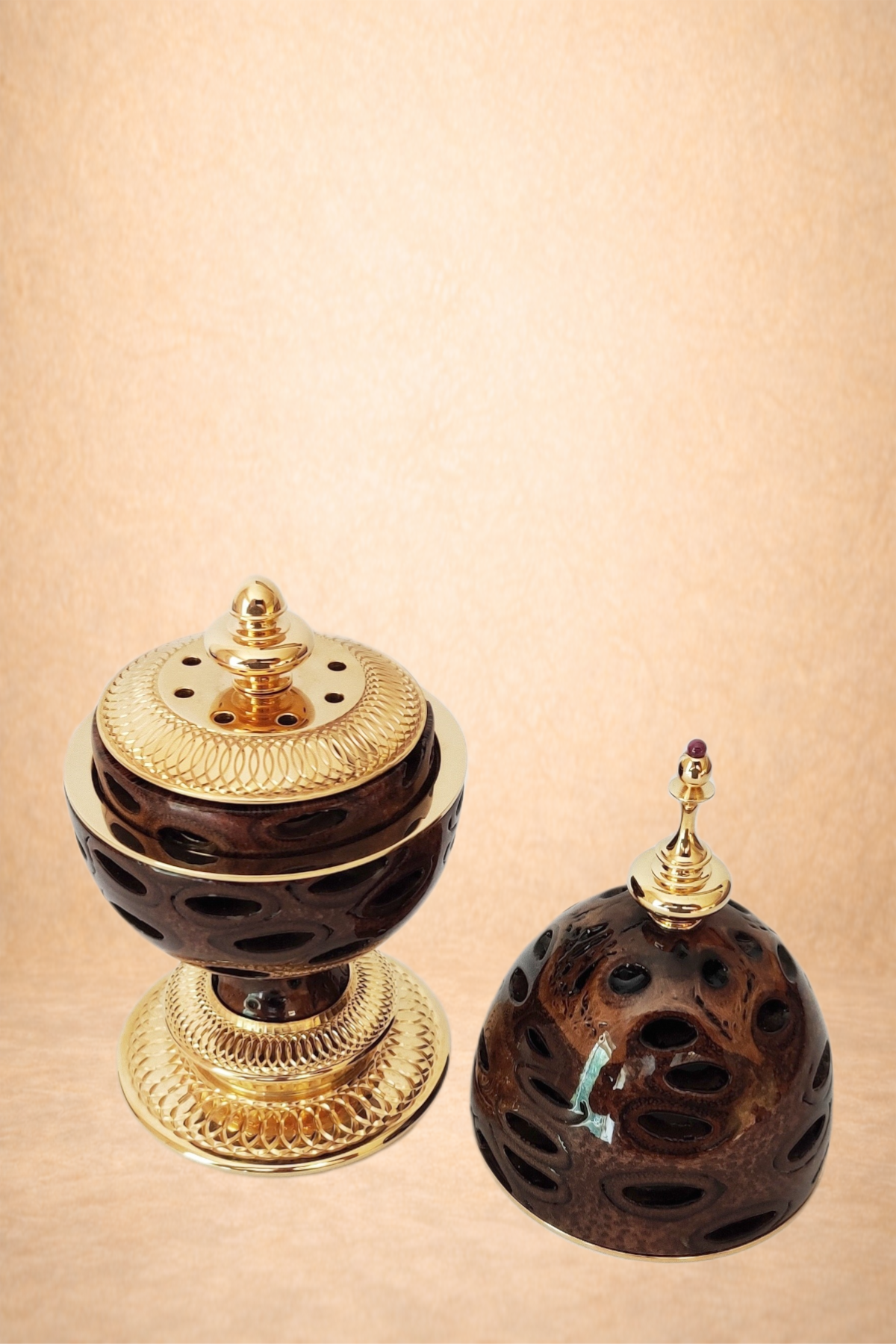 Decorative jewelry boxes with dark wooden and gold accents.