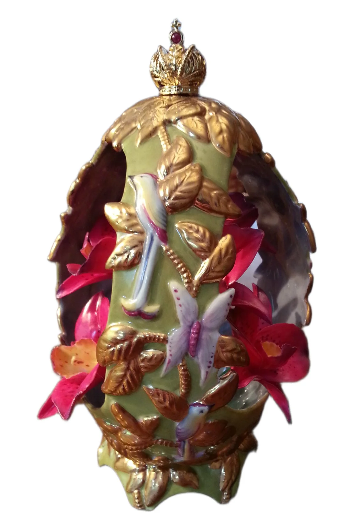 Orchid Egg open to reveal its handcrafted surprise.