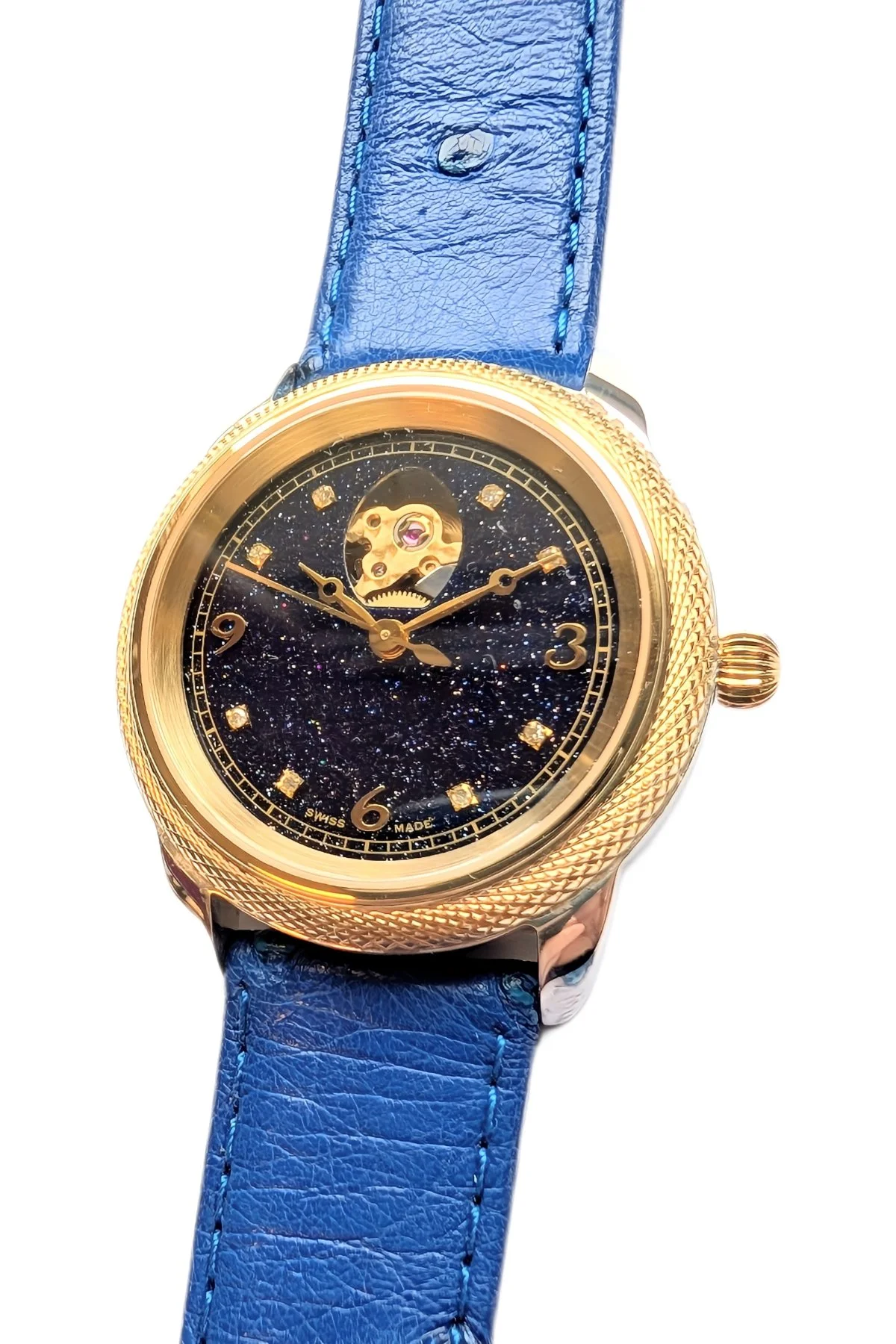 Theo Fabergé Series 8 ladies watch model TF802 featuring stellar goldstone dial, 18 kt yellow gold bezel, sterling silver case and diamond hour markers.