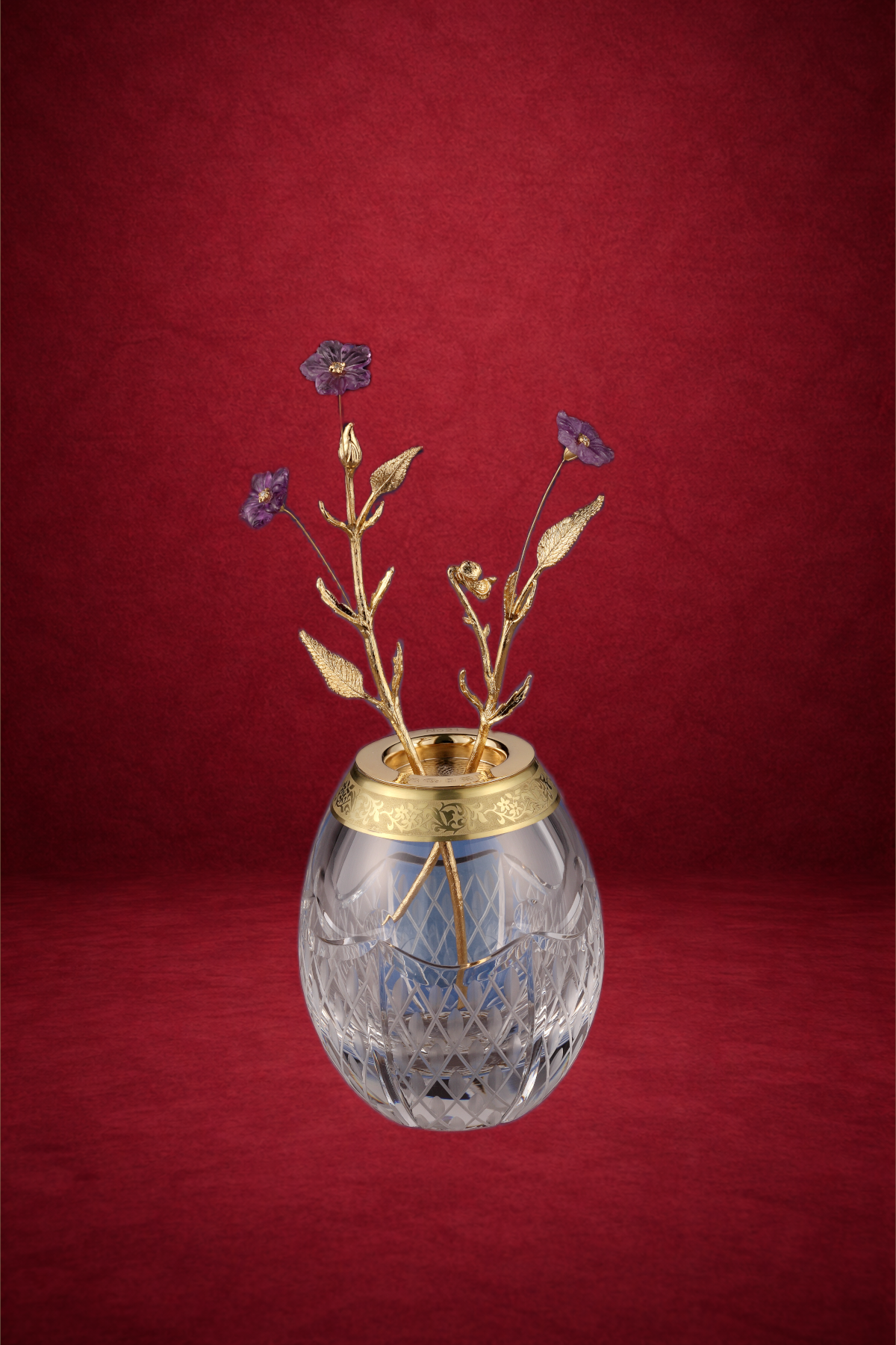 Tremblant Violet egg creation by Theo Fabergé featuring tremblant violet flowers crafted in gold and enamel.