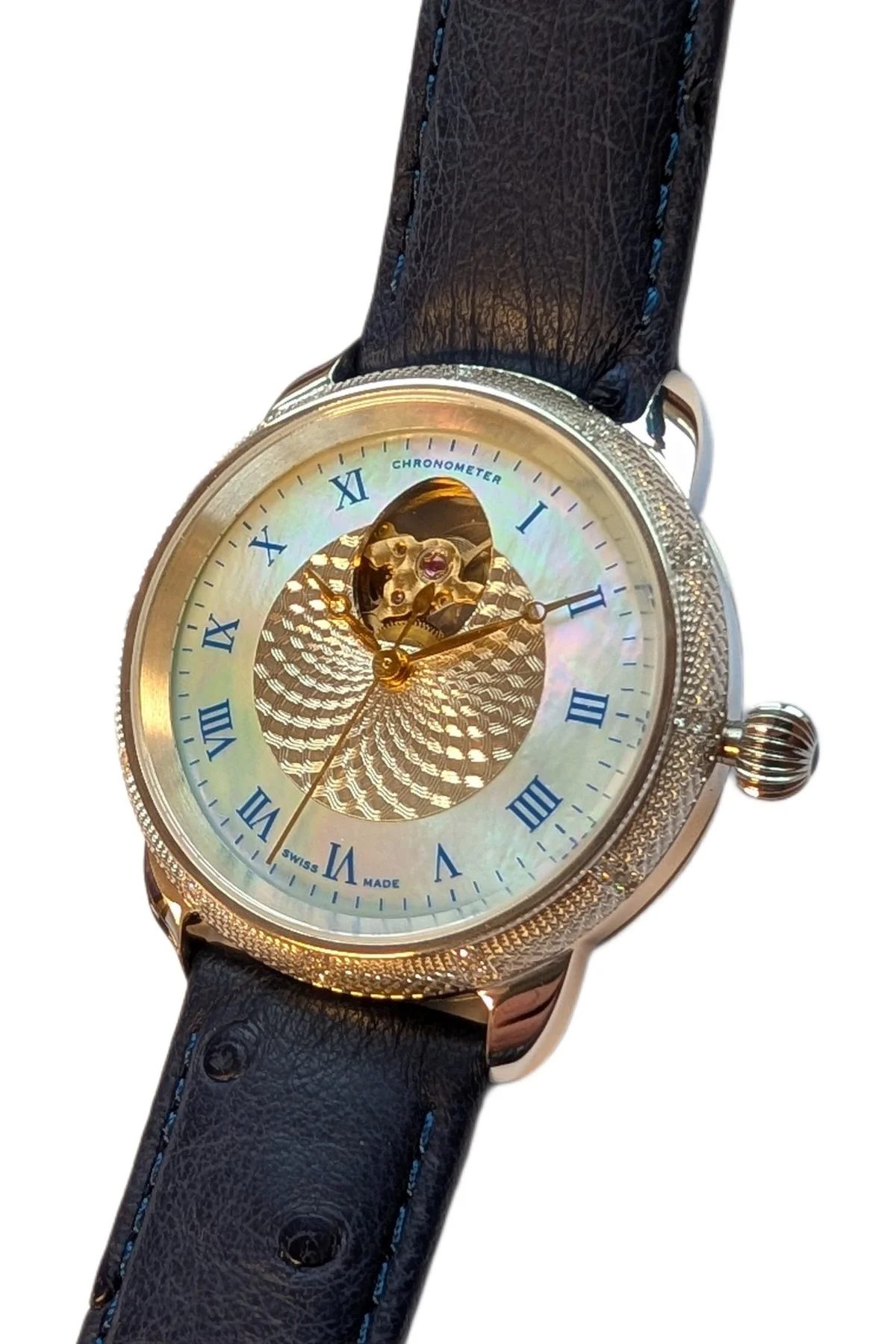 Series 4 Model 411, a Swiss-made Theo Fabergé watch in 18-carat yellow gold and sterling silver.