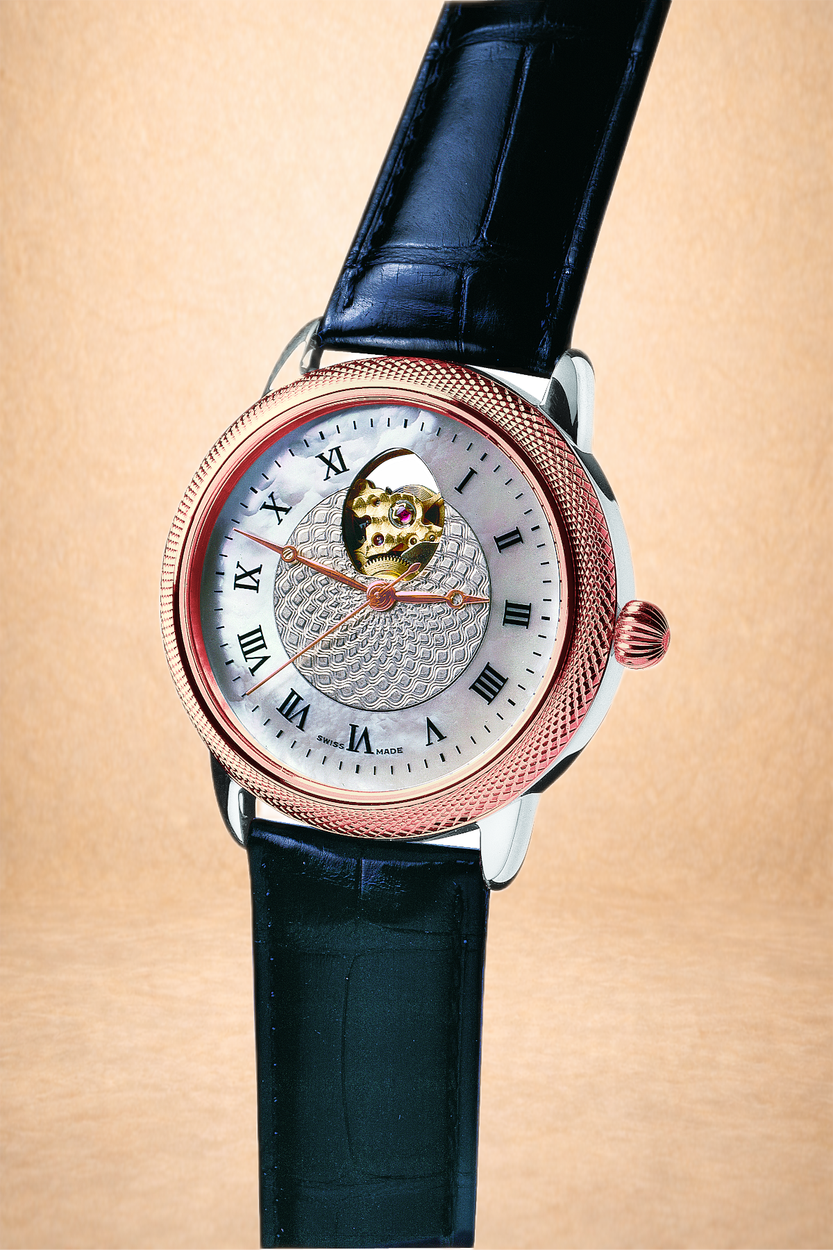 A luxury wristwatch with a silver face, Roman numeral hour markers, a visible mechanical movement at the top, and a black leather strap.