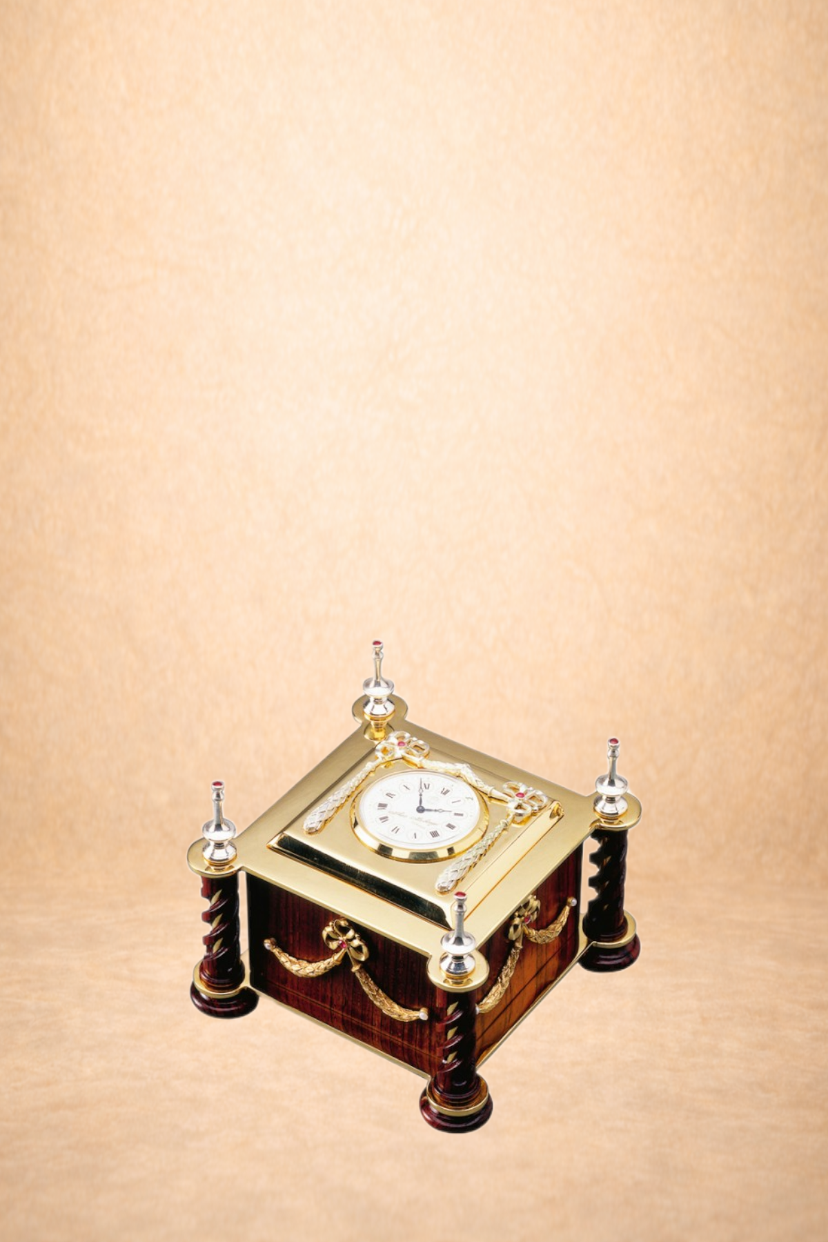 A decorative table clock with a gold face, Roman numerals, and ornate embellishments, set on a wooden table with a light background.
