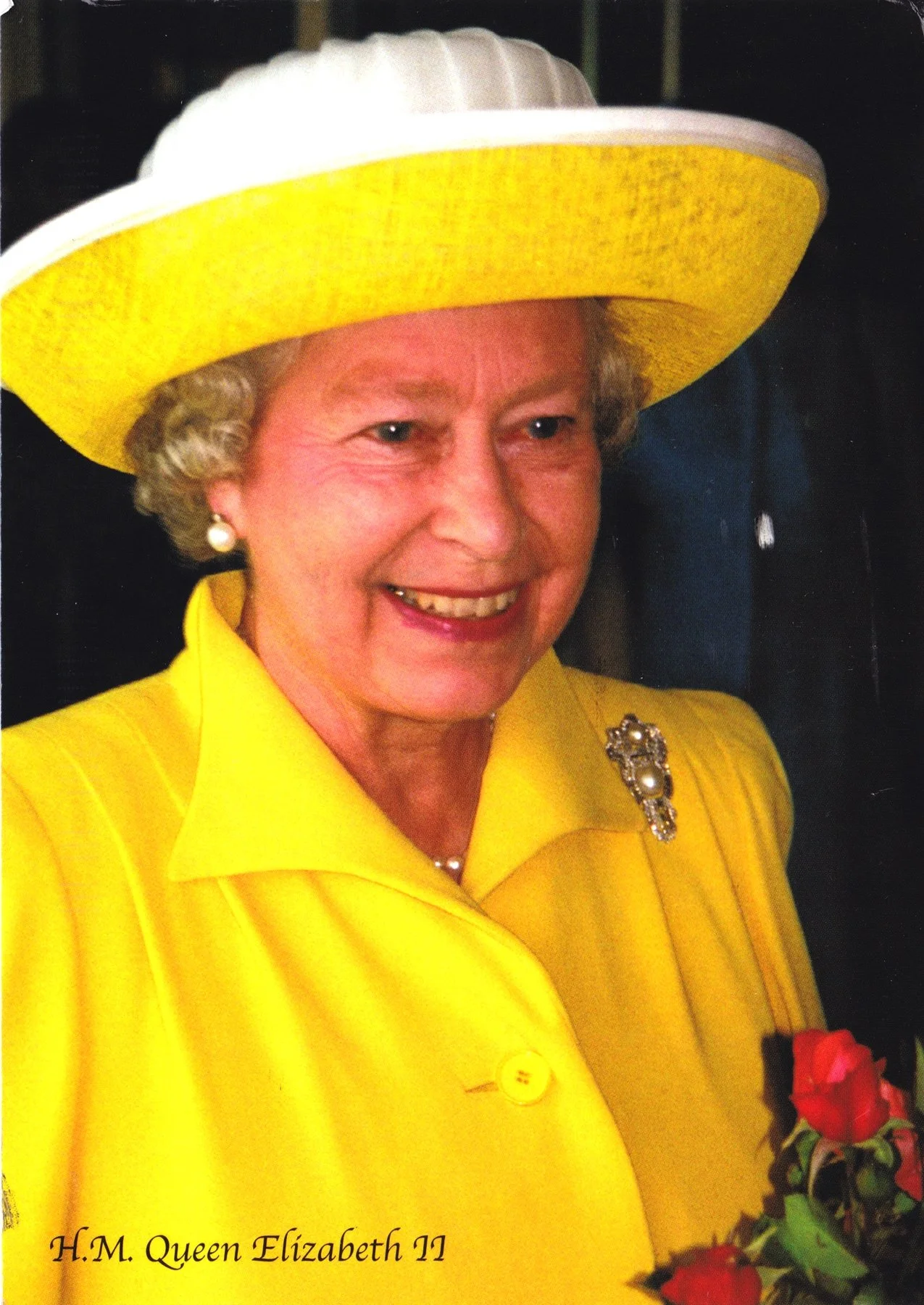 Queen Elizabeth II photographed wearing yellow attire representing the historic royal connection to Fabergé creations and the British Royal Collection.