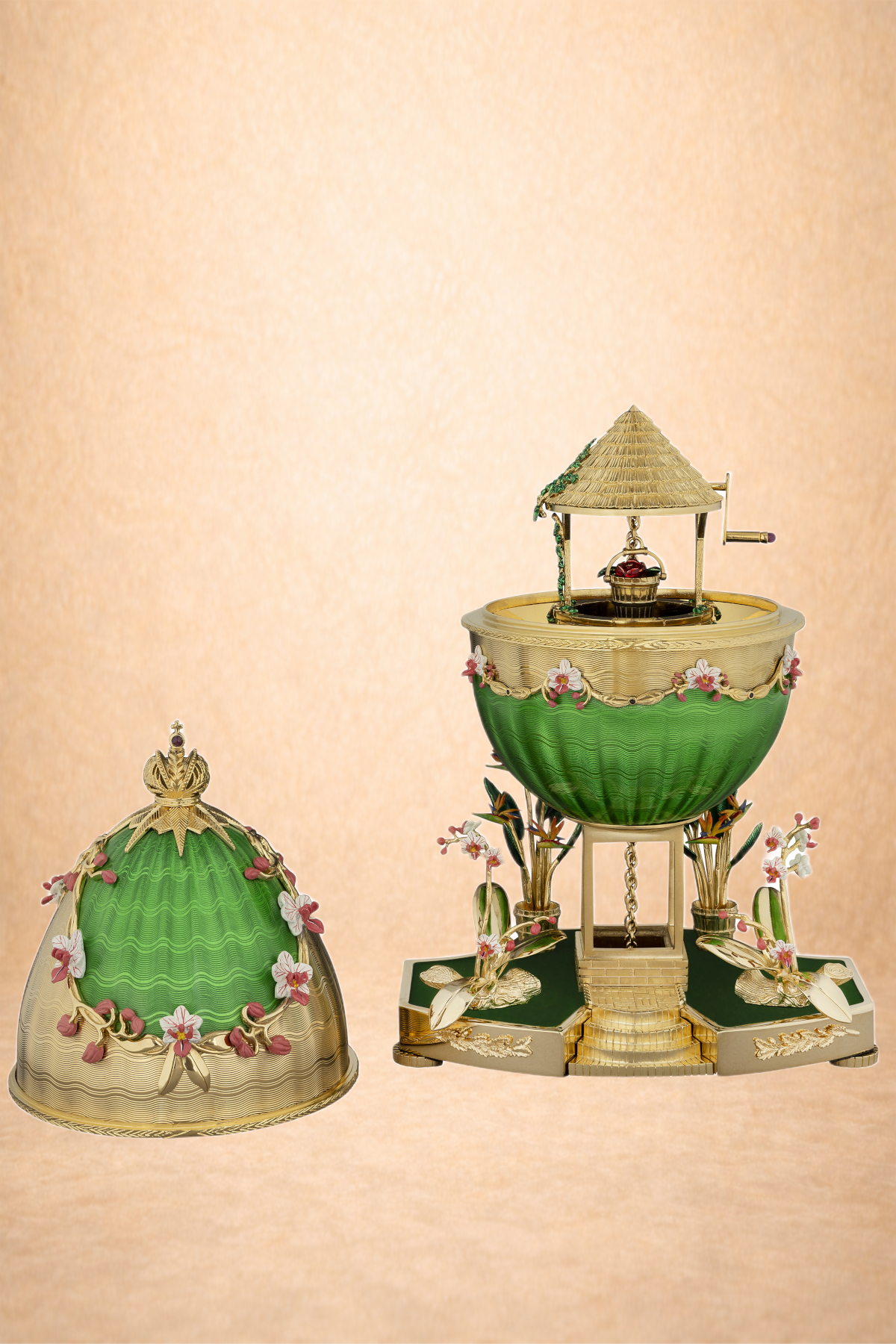 Decorative jewelry box designed as a miniature well with a green and gold color scheme, adorned with pink and white flowers, set against a beige background.