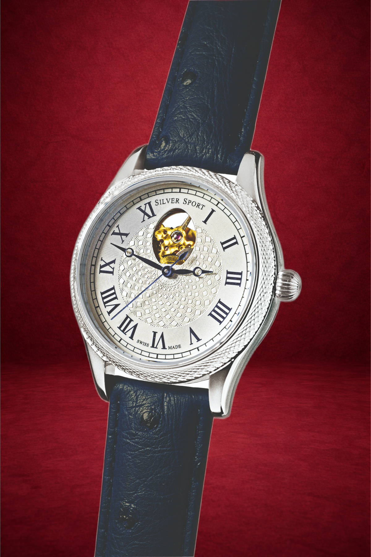 Theo Fabergé Series 9 stainless steel watch model TF901 with sterling silver bezel, Côtes de Genève dial and signature Fabergé egg cut-out revealing the automatic movement.