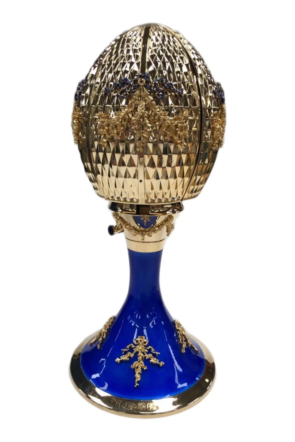 Celestial Passion egg creation by Theo Fabergé inspired by cosmic motifs and celestial symbolism in gold and enamel.