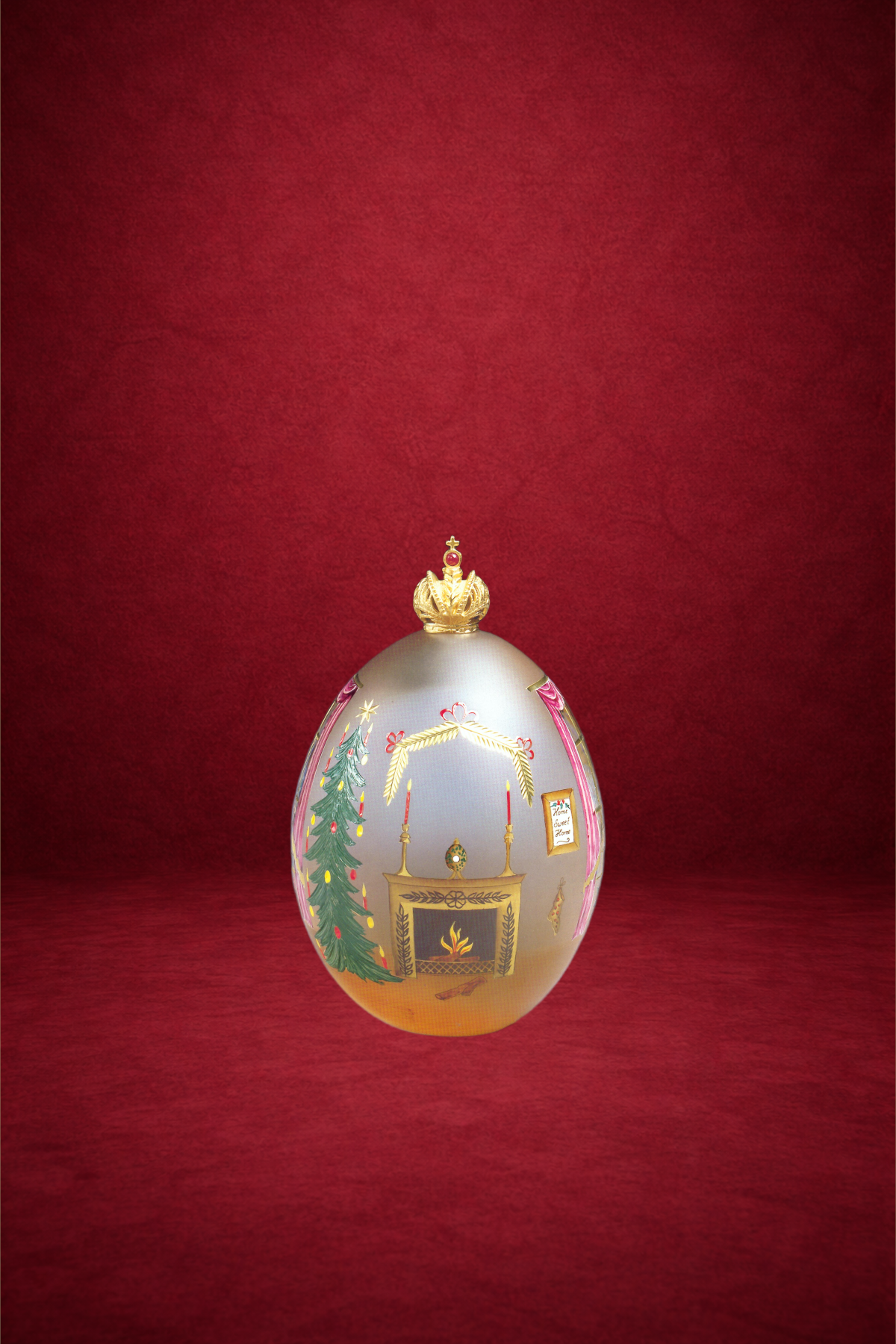 Yuletide egg creation by Theo Fabergé inspired by festive Christmas traditions crafted in enamel and gold.
