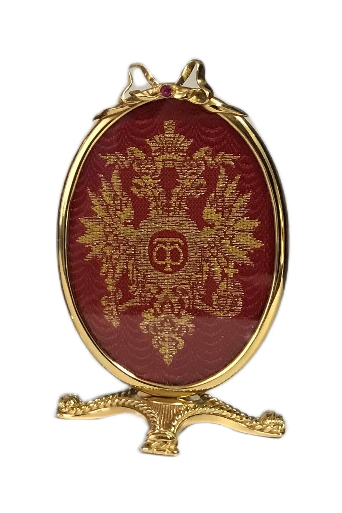 Imperial Romanov Egg open to reveal its handcrafted surprise.