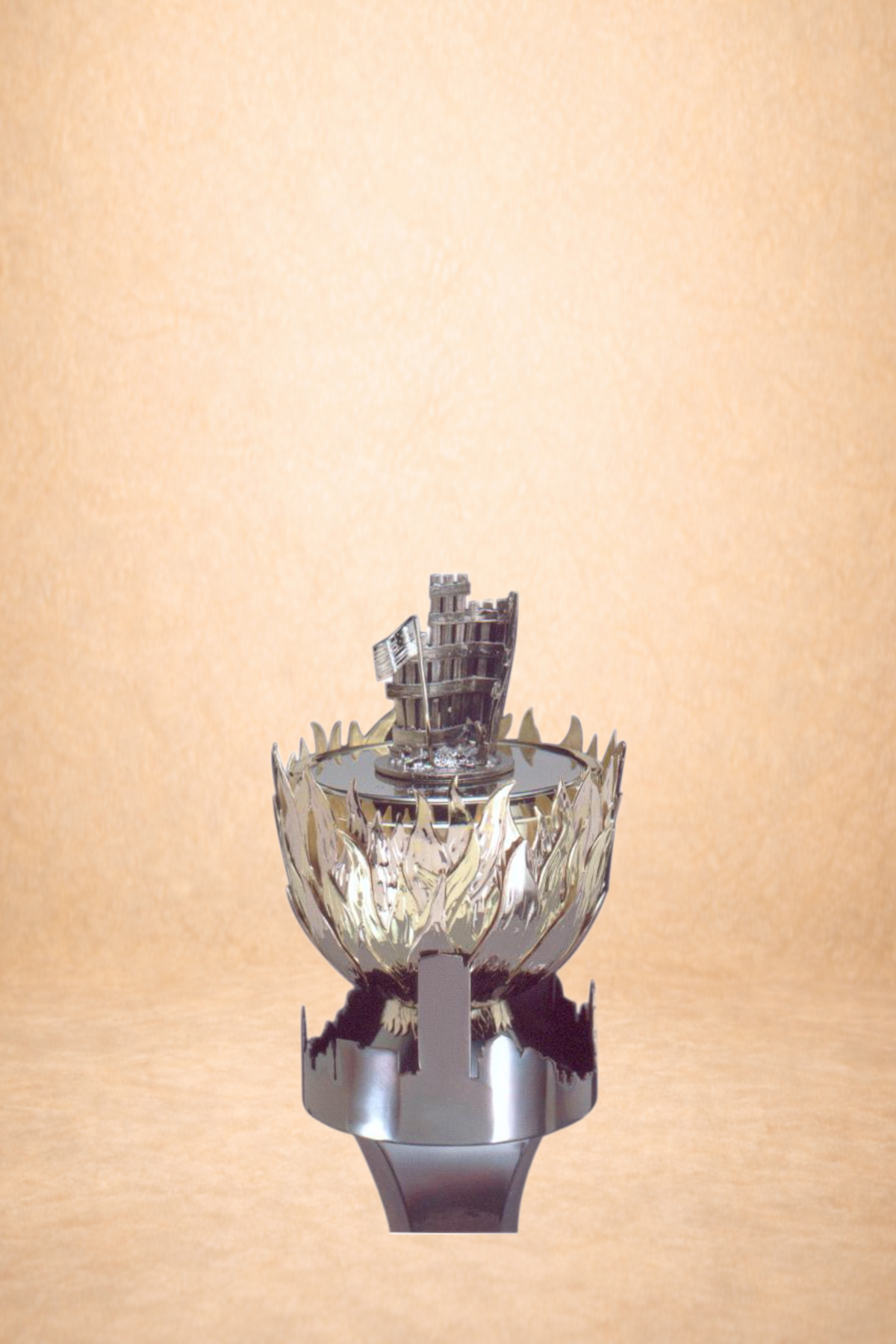 The image shows a metallic trophy resembling a flame with a miniature silver sailing ship mounted on top, set against a plain beige background.