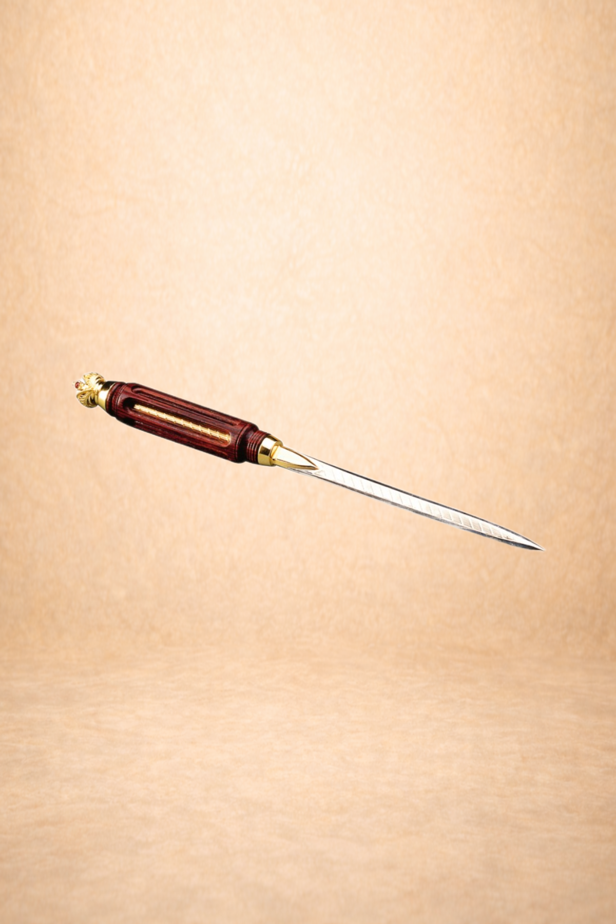 Close-up of a vintage letter opener with a decorative handle and a long, sharp metal blade, set against a soft beige background.