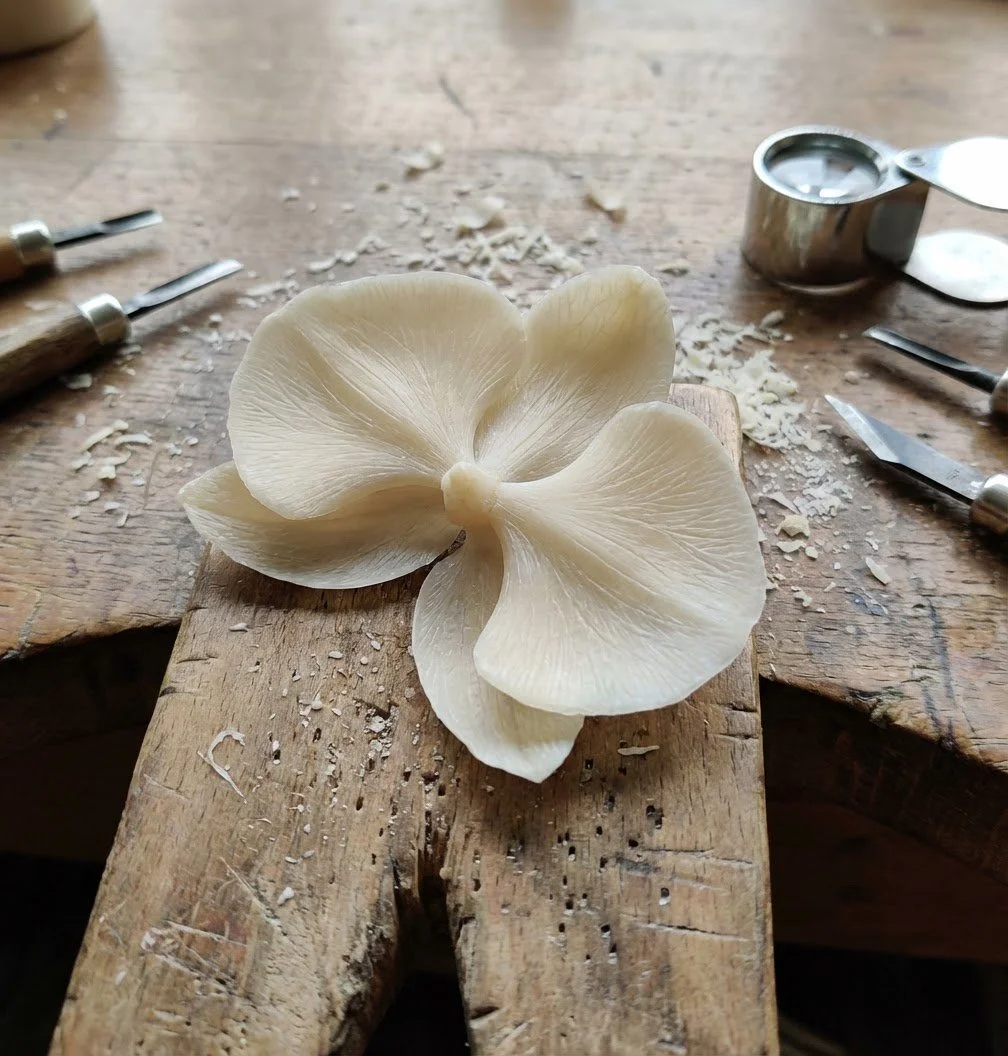 Hand-carved wax orchid model used to create intricate metal decorations for a Fabergé egg.