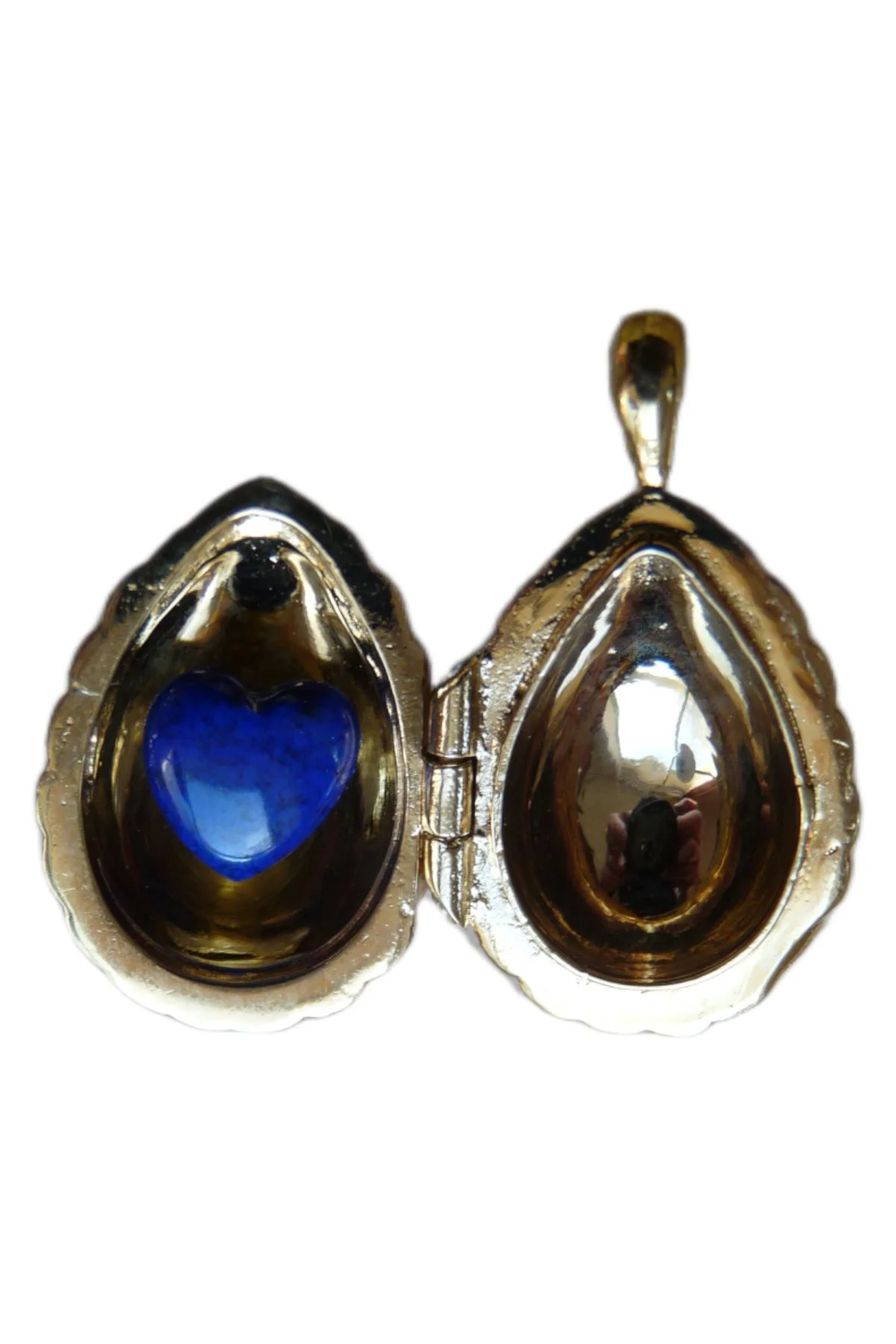 Passion Pendant TFPS951 open to reveal its handcrafted surprise.