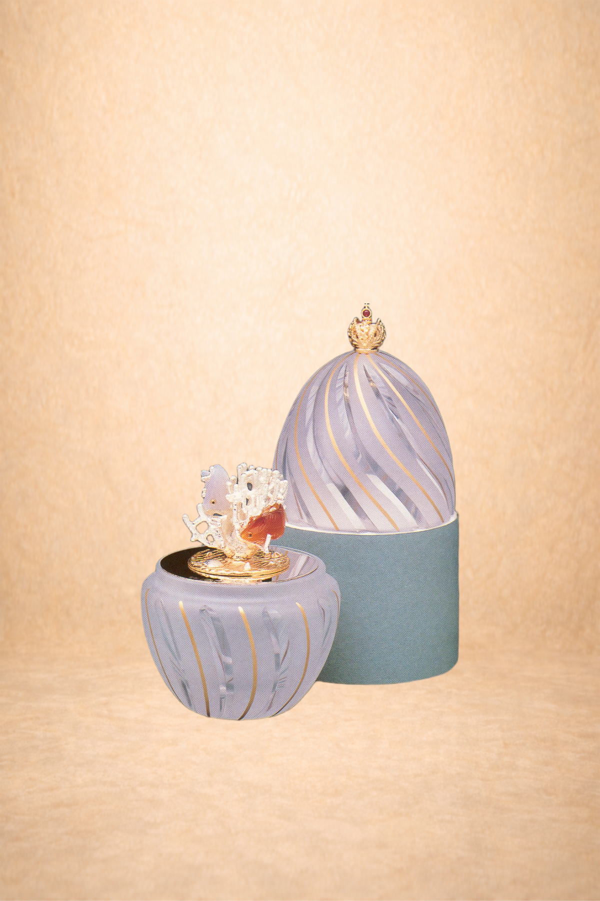 Decorative jewelry box with a lid and a detachable container, both with a striped purple and gold pattern, set against a beige background.