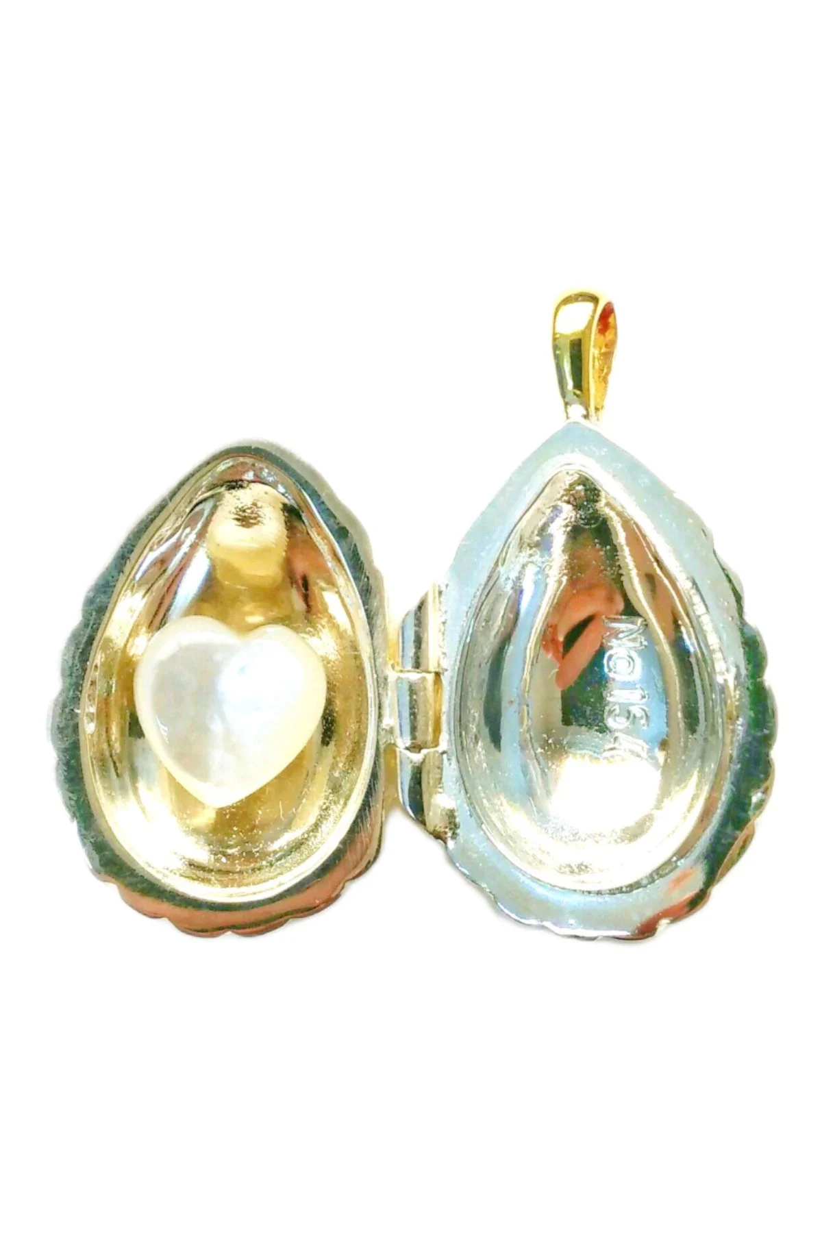 Passion Pendant TFPS940 open to reveal its handcrafted surprise.