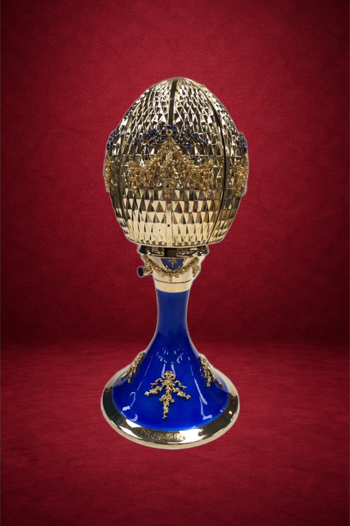 Celestial Passion egg creation by Theo Fabergé inspired by cosmic motifs and celestial symbolism in gold and enamel.
