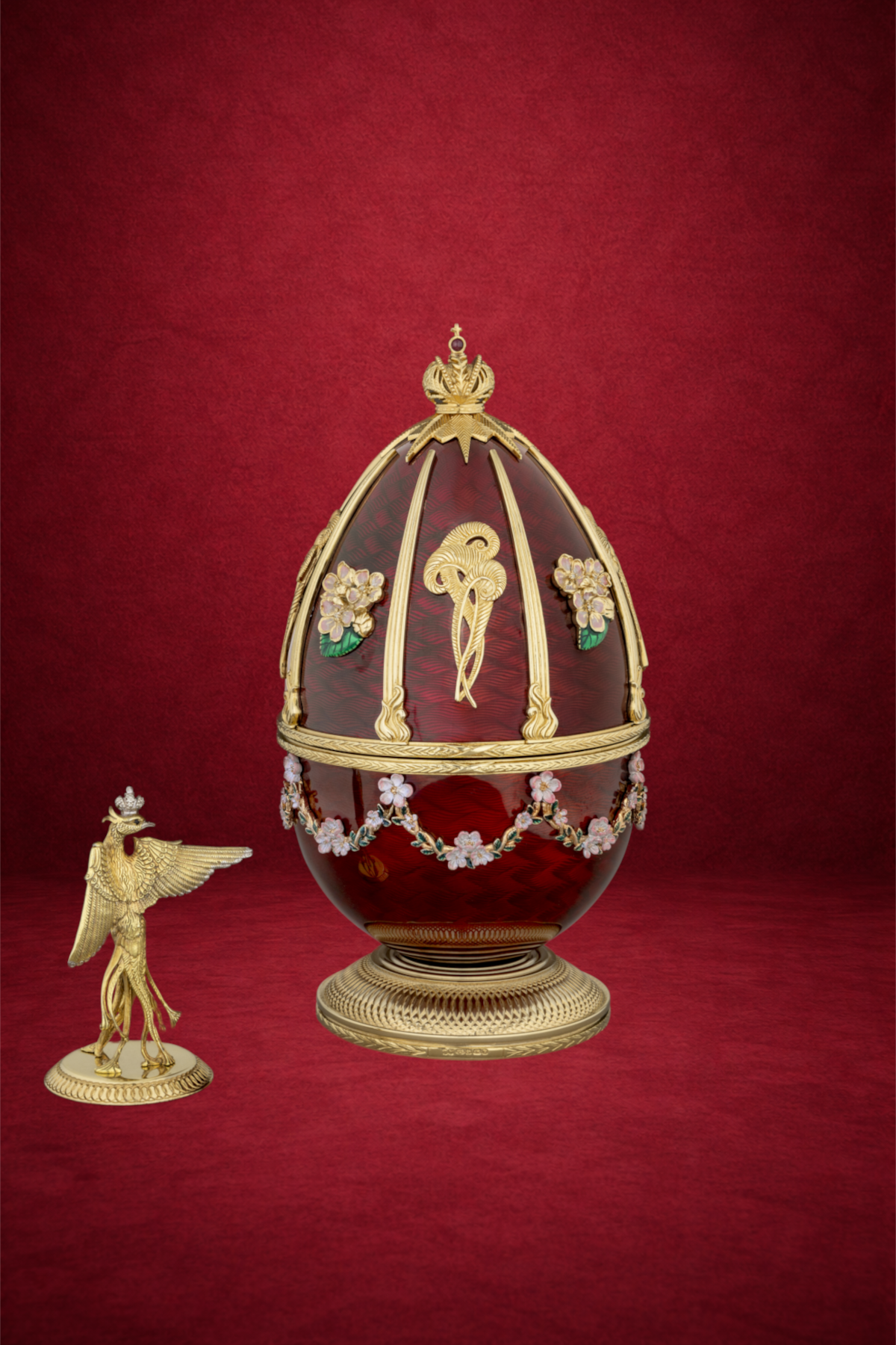 Firebird egg creation by Theo Fabergé inspired by the Russian Firebird legend crafted with vibrant enamel and gold.