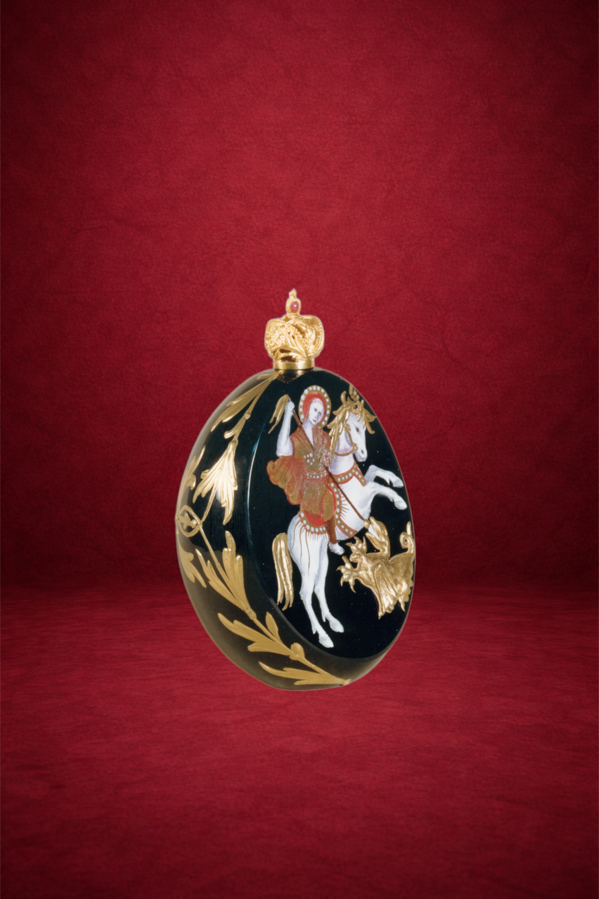Icon egg creation by Theo Fabergé inspired by Russian religious iconography with gold and enamel craftsmanship.