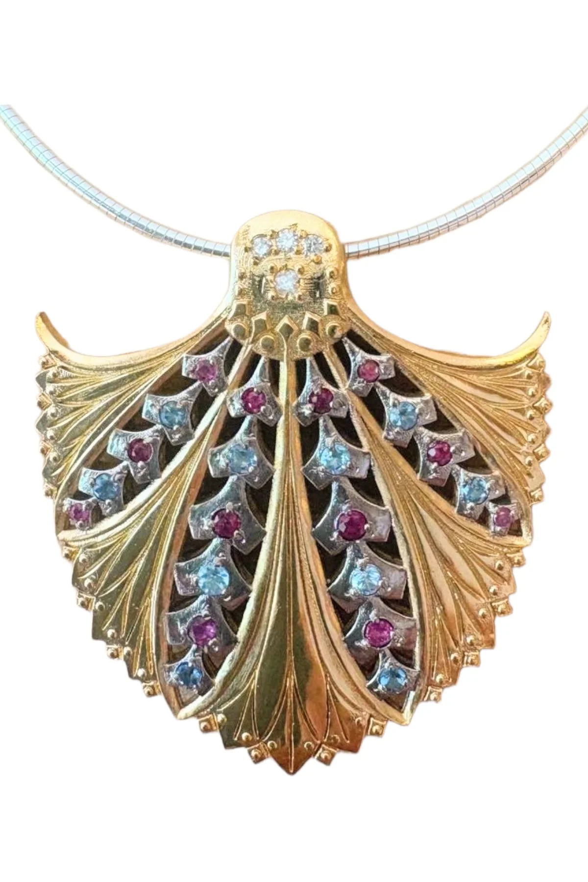 Sparkling 20’S Pendant by Theo Fabergé in rubies, topaz and diamonds.