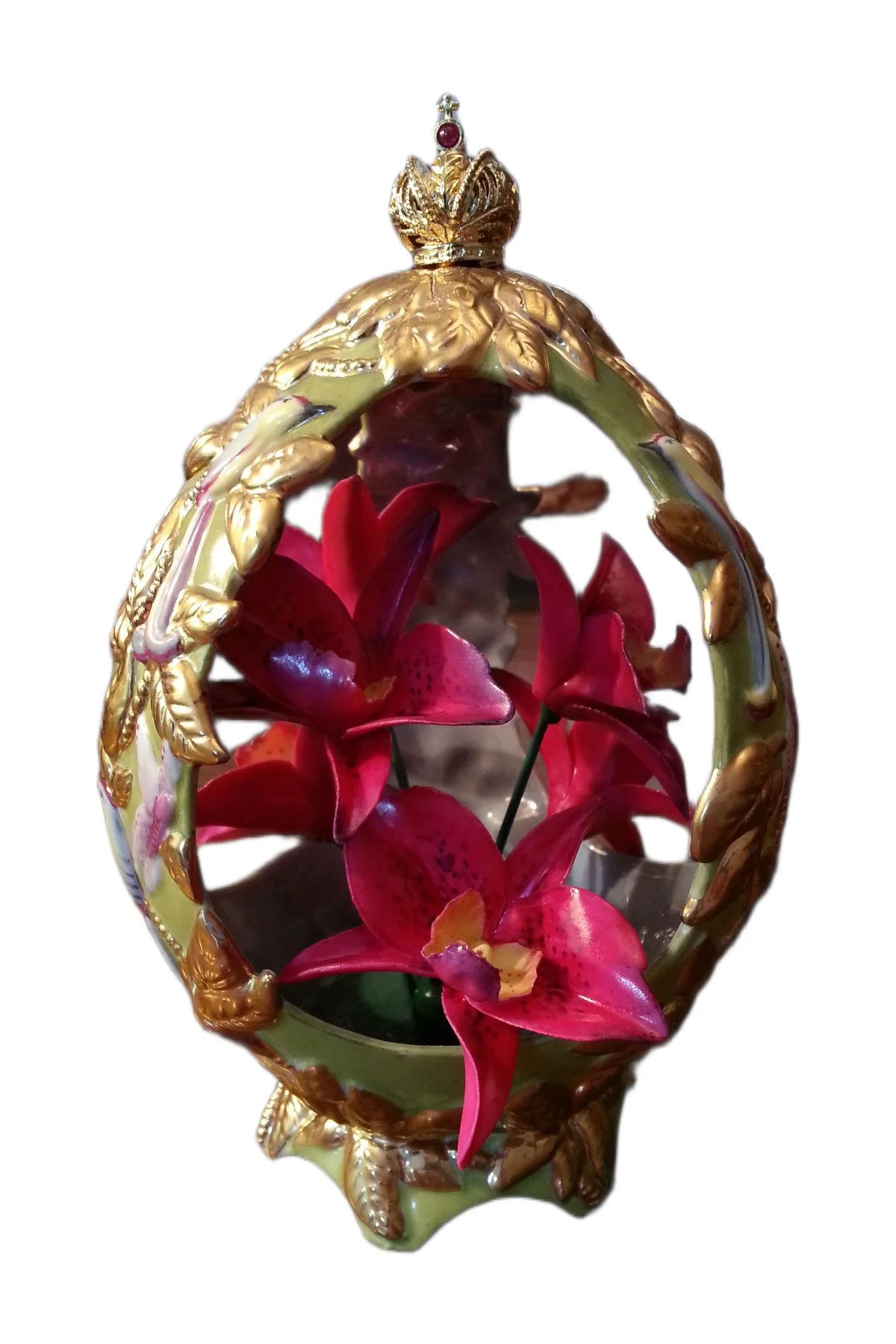 Orchid egg creation by Theo Fabergé inspired by orchid flowers crafted in enamel and gold.