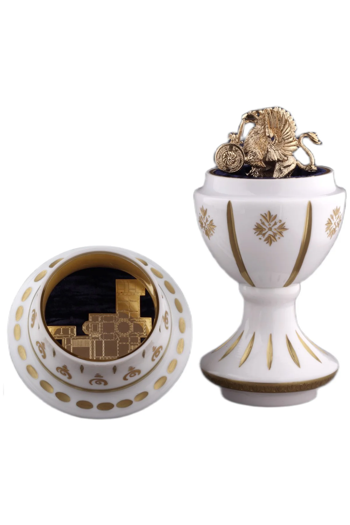 Mariinsky Romanov Egg open to reveal its handcrafted surprise.