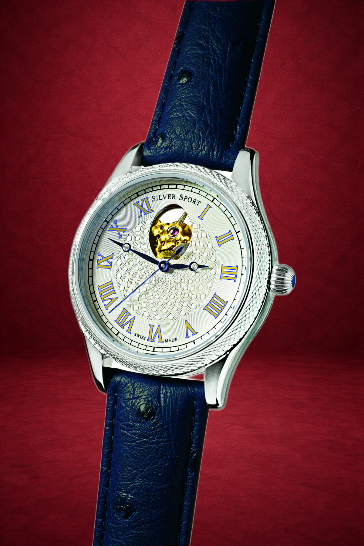 Theo Fabergé Series 9 stainless steel watch model TF903 with blue dial, stainless steel case and Fabergé egg cut-out revealing the mechanical movement.