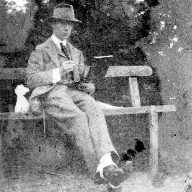 Nicholas Fabergé, son of Carl Fabergé and father of Theo Fabergé, seated outdoors during the early twentieth century.