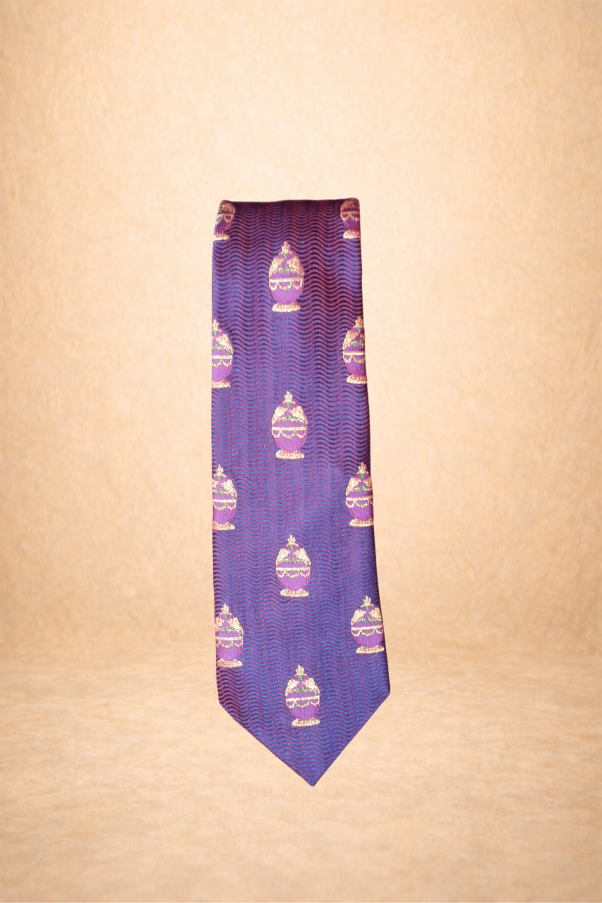 Purple tie with a repeating pattern of ornate perfume bottles on a wavy background.