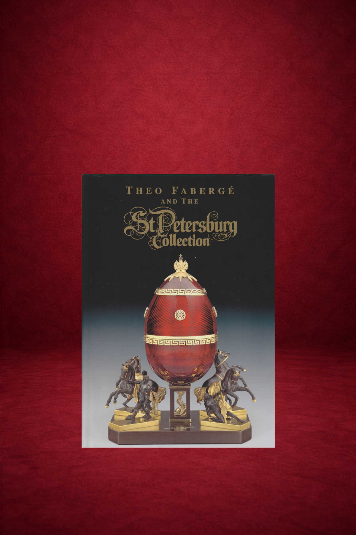 Book titled 'Theo Fabergé and the St. Petersburg Collection' featuring an ornate imperial Easter egg with gold accents and four horses at the base, set against a dark background.